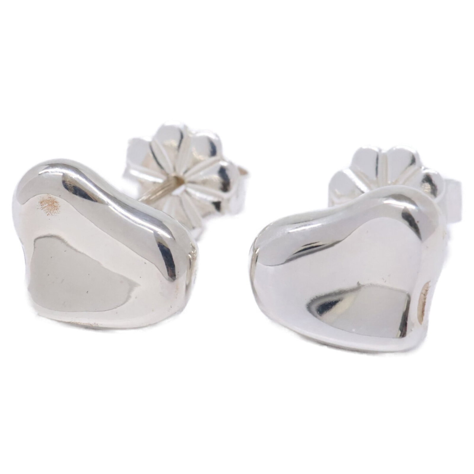 Silver 925 stud earrings by Tiffany: Silver 925 stud earrings by Tiffany Silver 925 stud earrings by Tiffany, featuring a classic design with a subtle shine. Made from high-quality silver, these earrings have a sleek 10mm x 8mm profile a