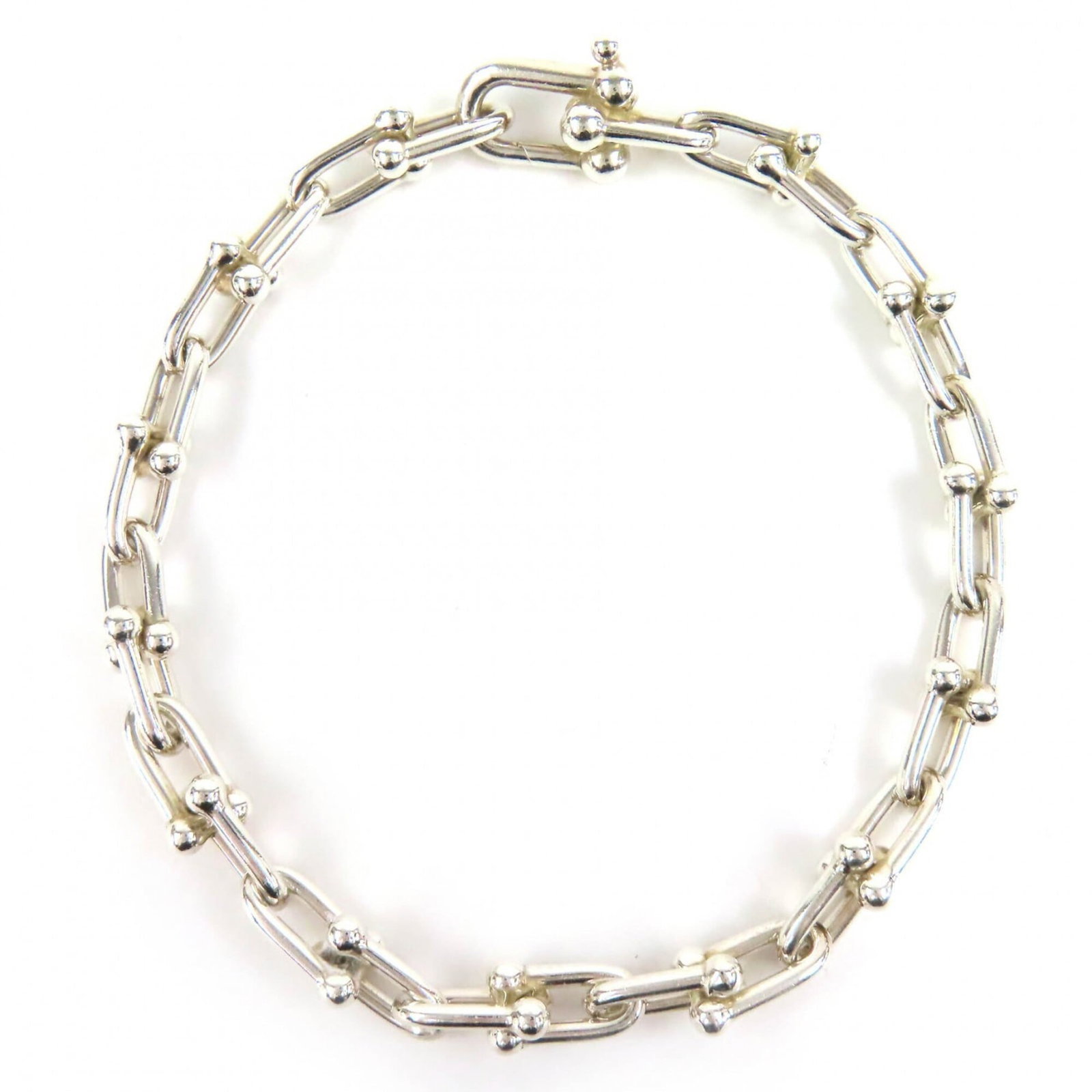 Silver Tiffany Link Bracelet: Silver Tiffany Link Bracelet Silver Tiffany Link Bracelet, featuring a sleek 5mm wide design with a total length of 20cm. Made from high-quality silver 925 material, this classic link bracelet showcas