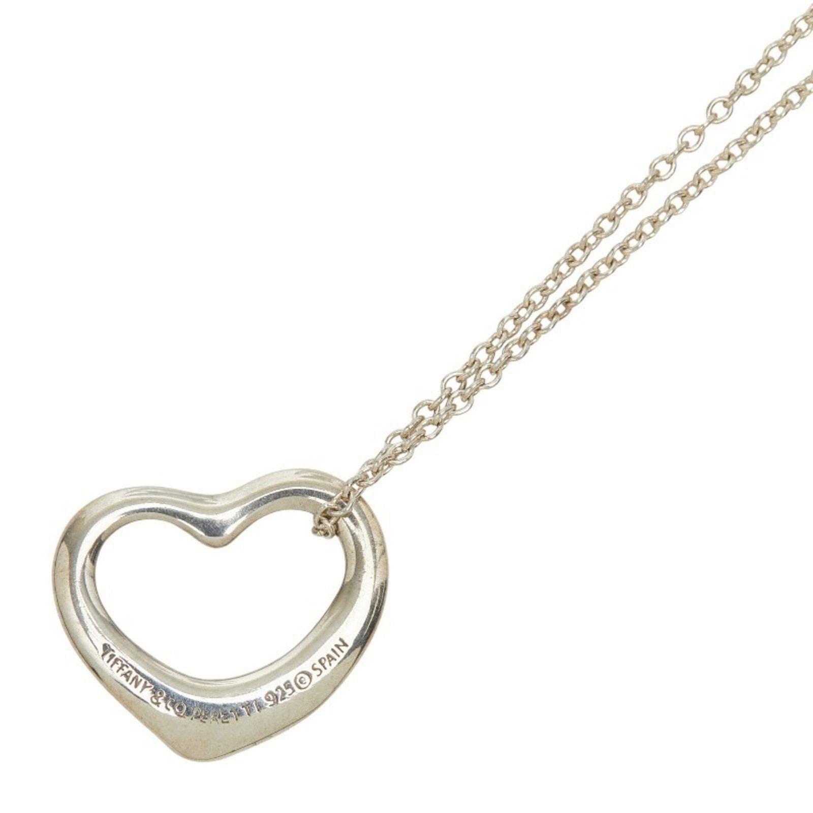 Sterling silver open heart necklace for women by Tiffany and Co: Sterling silver open heart necklace for women by Tiffany and Co Sterling silver open heart necklace by Tiffany and Co, featuring a classic design with a 13.6mm x 15.1mm pendant. This necklace showcase