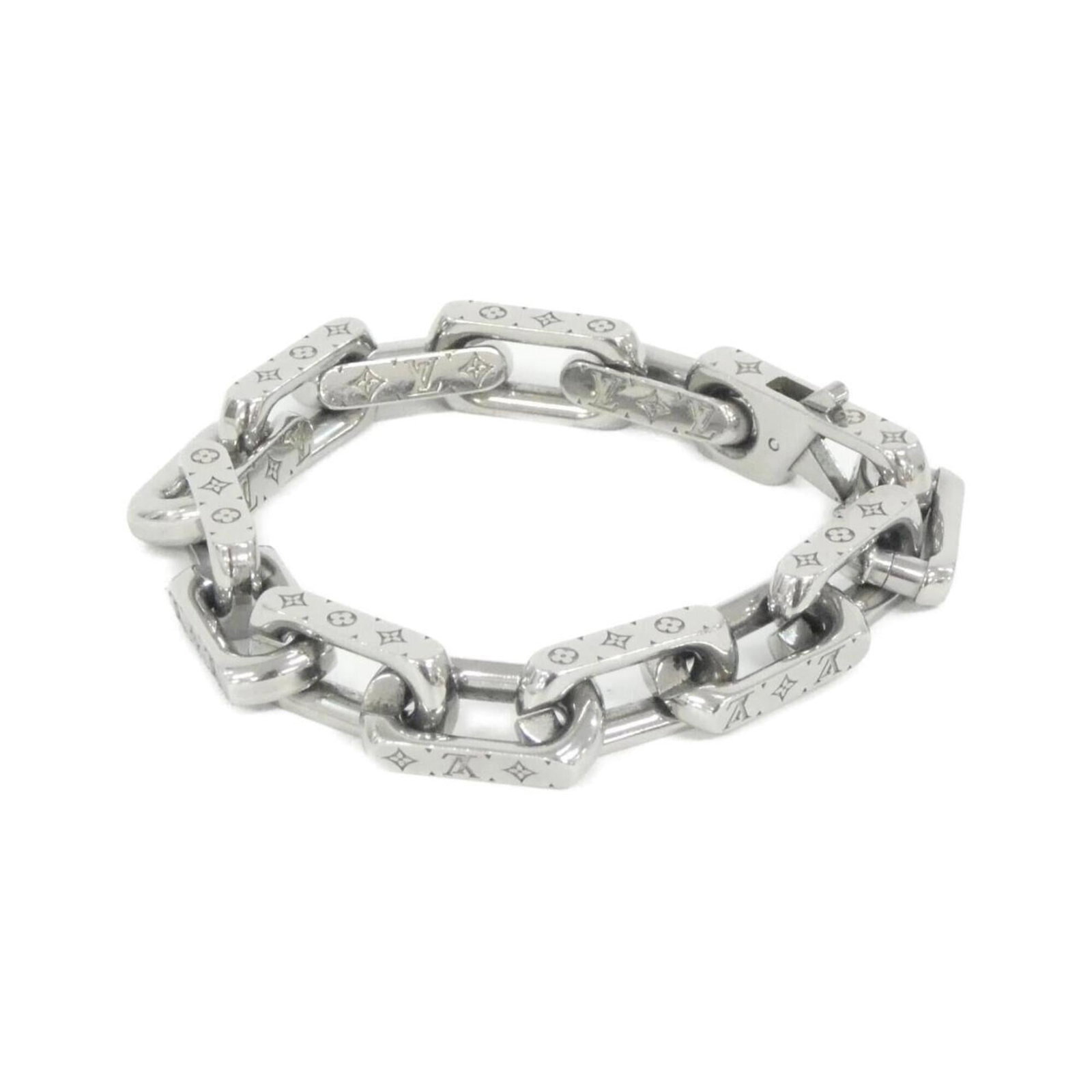Vuitton Louis Charm Bracelet: Vuitton Louis Charm Bracelet Used Louis Vuitton Charm Bracelet in silver, featuring some scratches and dirt, but overall in very good condition. A few traces of usage can be seen, adding to its