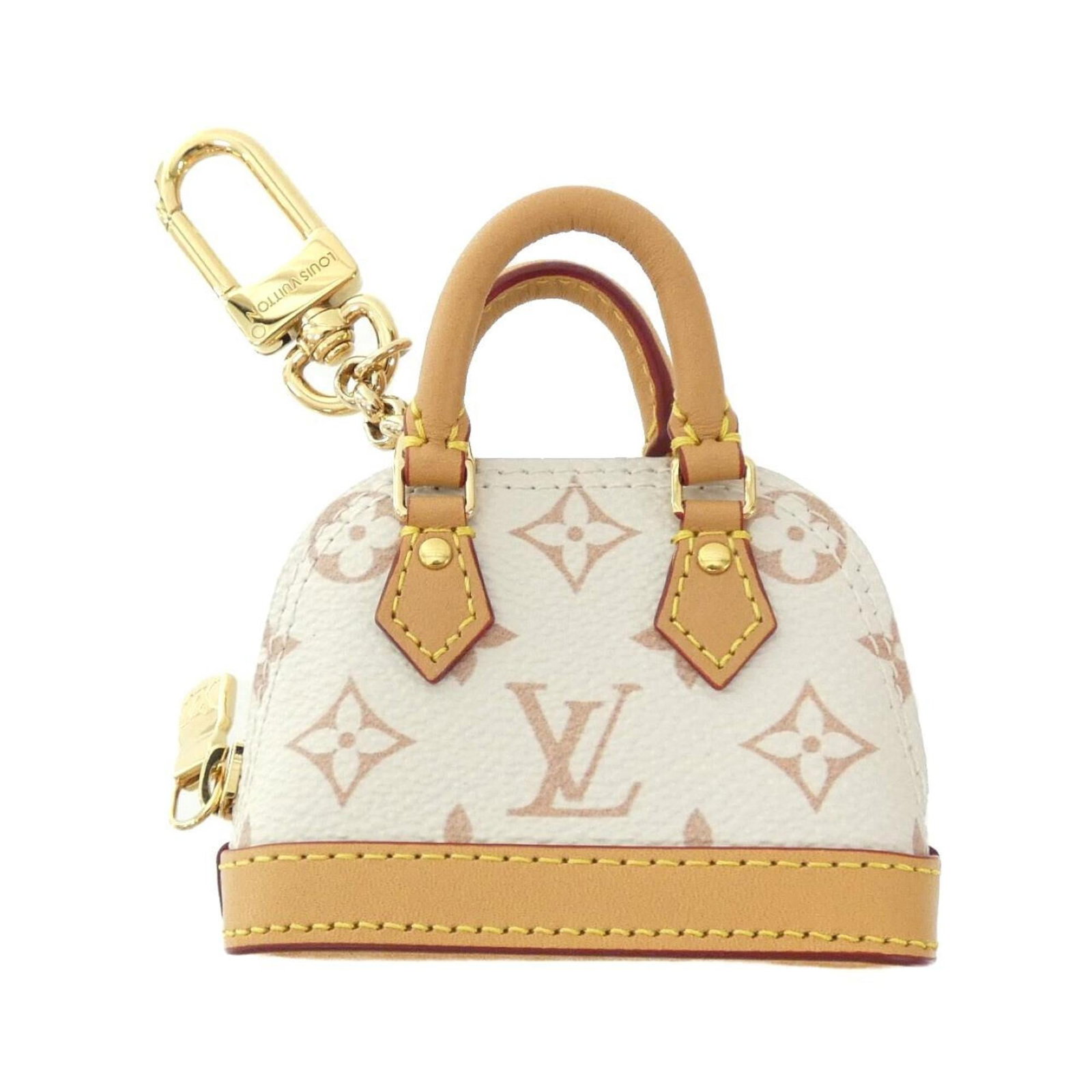Louis Vuitton Handbag Charm Canvas: Louis Vuitton Handbag Charm Canvas Dune-colored canvas charm from Louis Vuitton, bearing a few traces of usage and minor scratches. The charm's condition is described as very good, with some signs of