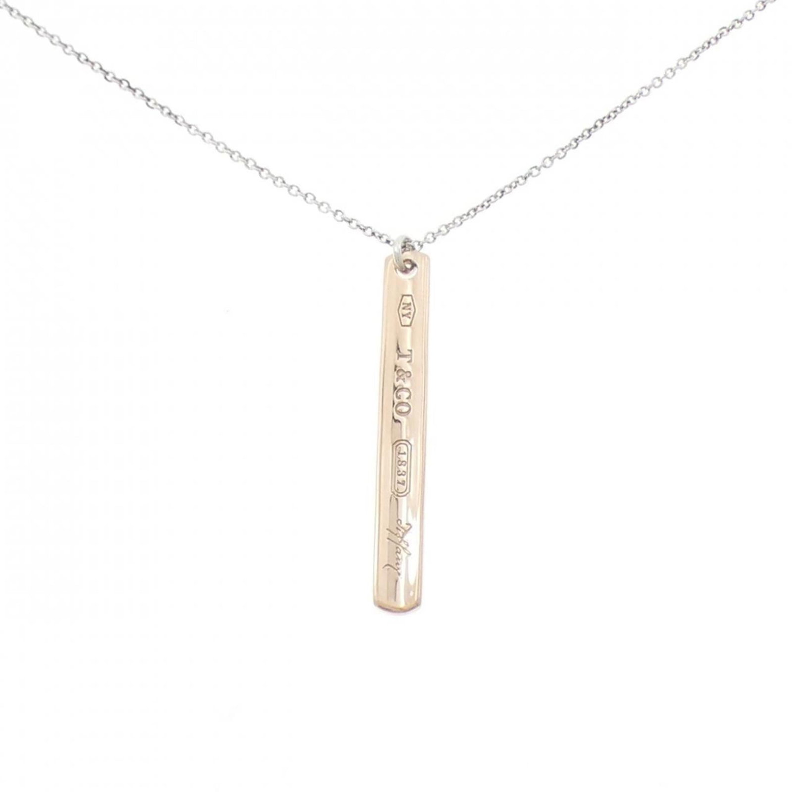 Small Bar Necklace from Tiffany 1837: Small Bar Necklace from Tiffany 1837 Small Bar Necklace from Tiffany & Co. features a sterling silver pendant with a classic design, measuring 30.8mm x 4mm. The necklace has a comfortable neck