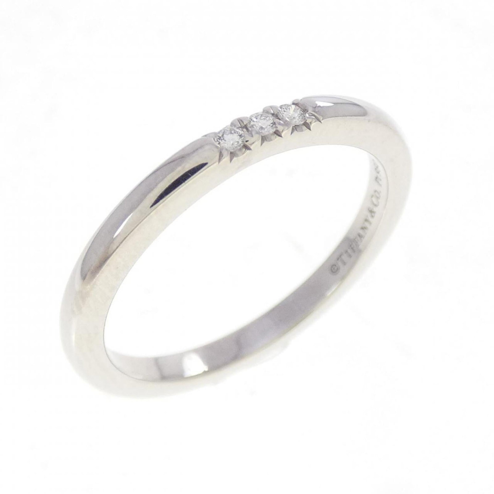 Platinum ring by Tiffany band: Platinum ring by Tiffany band Platinum ring by Tiffany features a diamond stone and is made from high-quality platinum material, making it a striking piece. The item is in like new condition with hard
