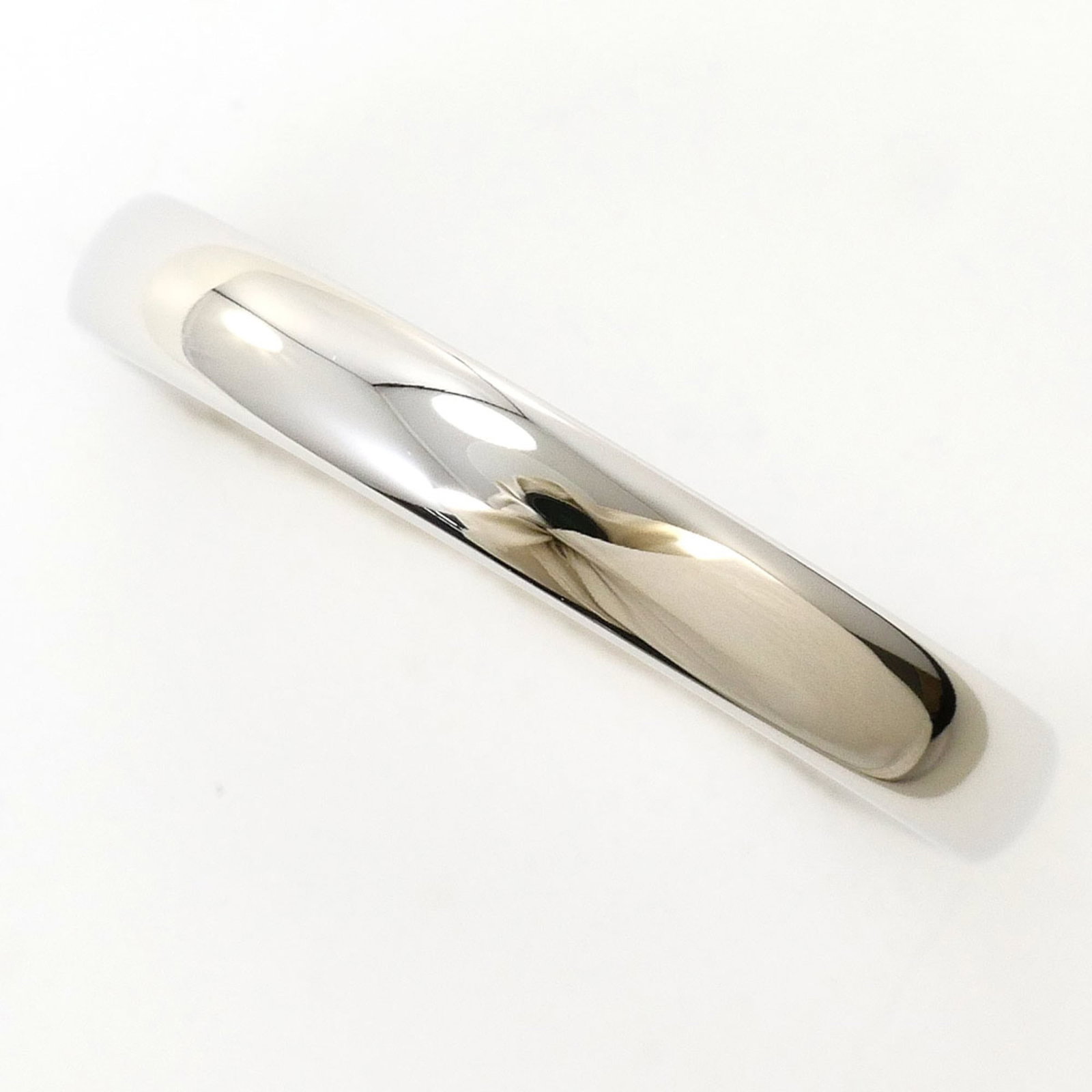 Platinum ring by Tiffany band: Platinum ring by Tiffany band Platinum ring by Tiffany Type band features a luxurious platinum construction, available in US size 7. This like-new condition piece boasts hardly any traces of usage and