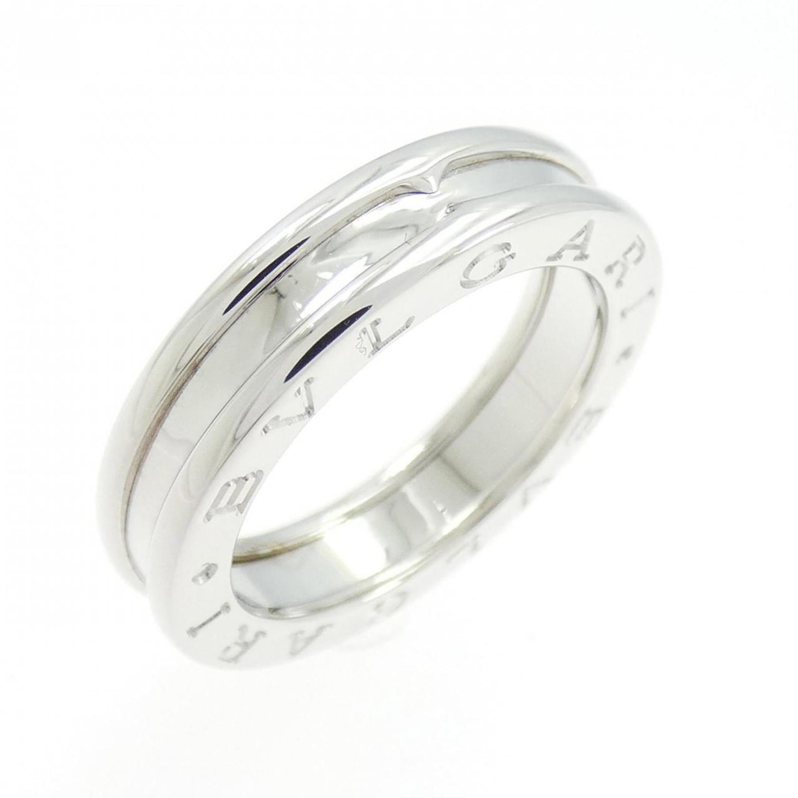 Bvlgari Band Ring White Gold (18K): Bvlgari Band Ring White Gold (18K) 18K white gold band ring from Bvlgari, featuring a slender 4.7mm width and a weight of 6.8g. This used (very good) condition piece boasts a subtle elegance with some