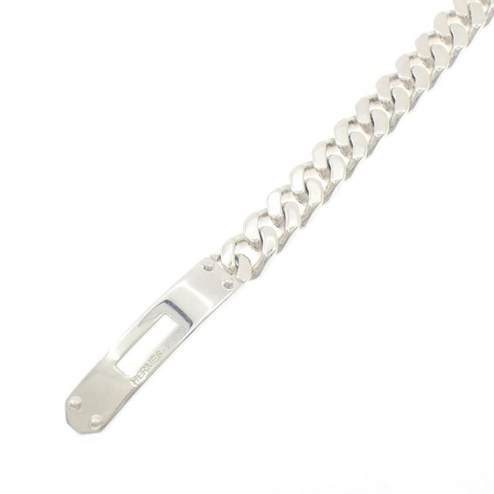 Silver Charm Bracelet 925 by Hermes: Silver Charm Bracelet 925 by Hermes Silver Charm Bracelet 925 by Hermes features a delicate, silver chain adorned with intricate charms, showcasing the timeless elegance of the iconic brand. This used