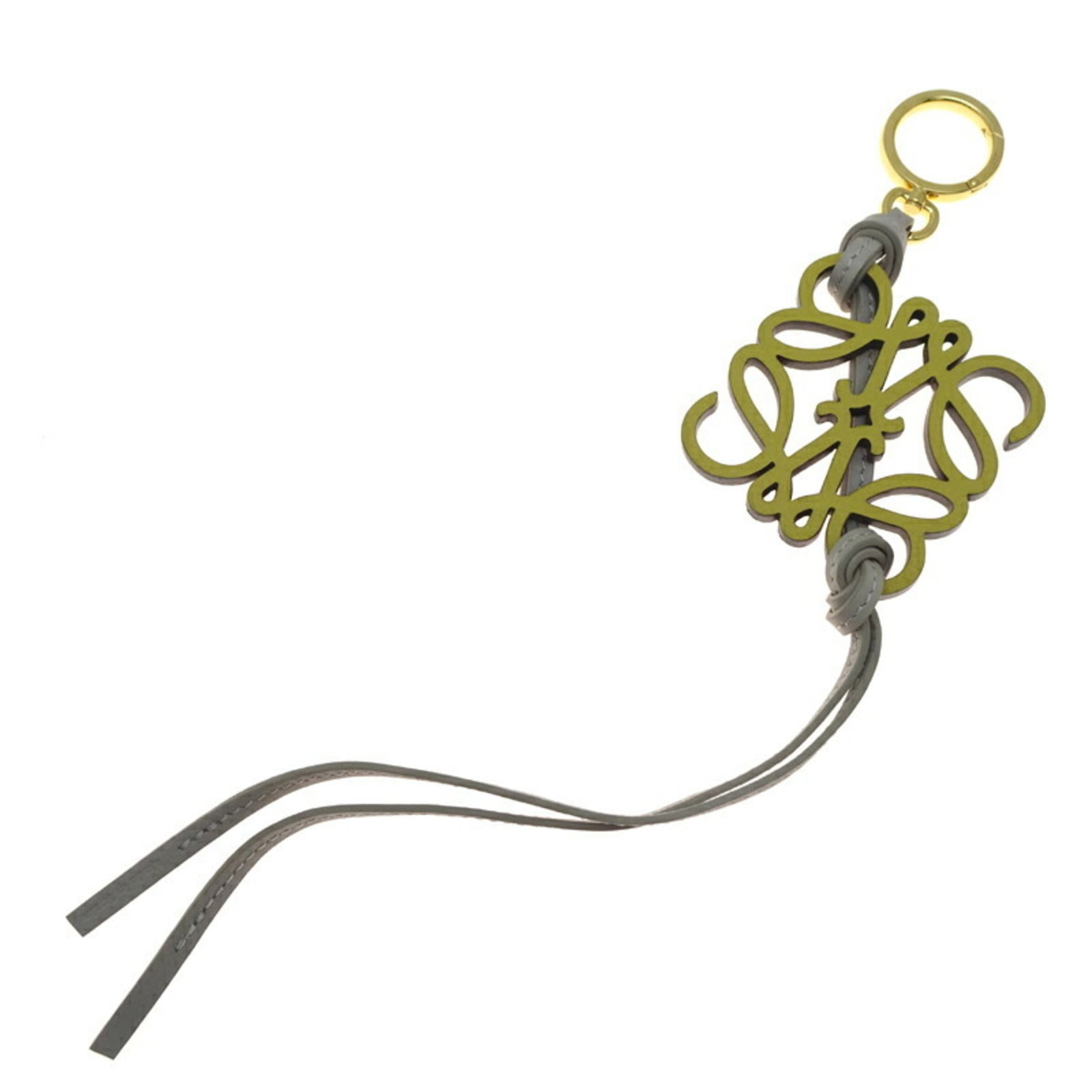 Loewe Handbag Charm Leather: Loewe Handbag Charm Leather Used Loewe Handbag Charm Leather in Brown, Gray, and Yellow. This leather charm measures 8mm x 37mm x 5mm and features a few traces of usage with some minor scratches and