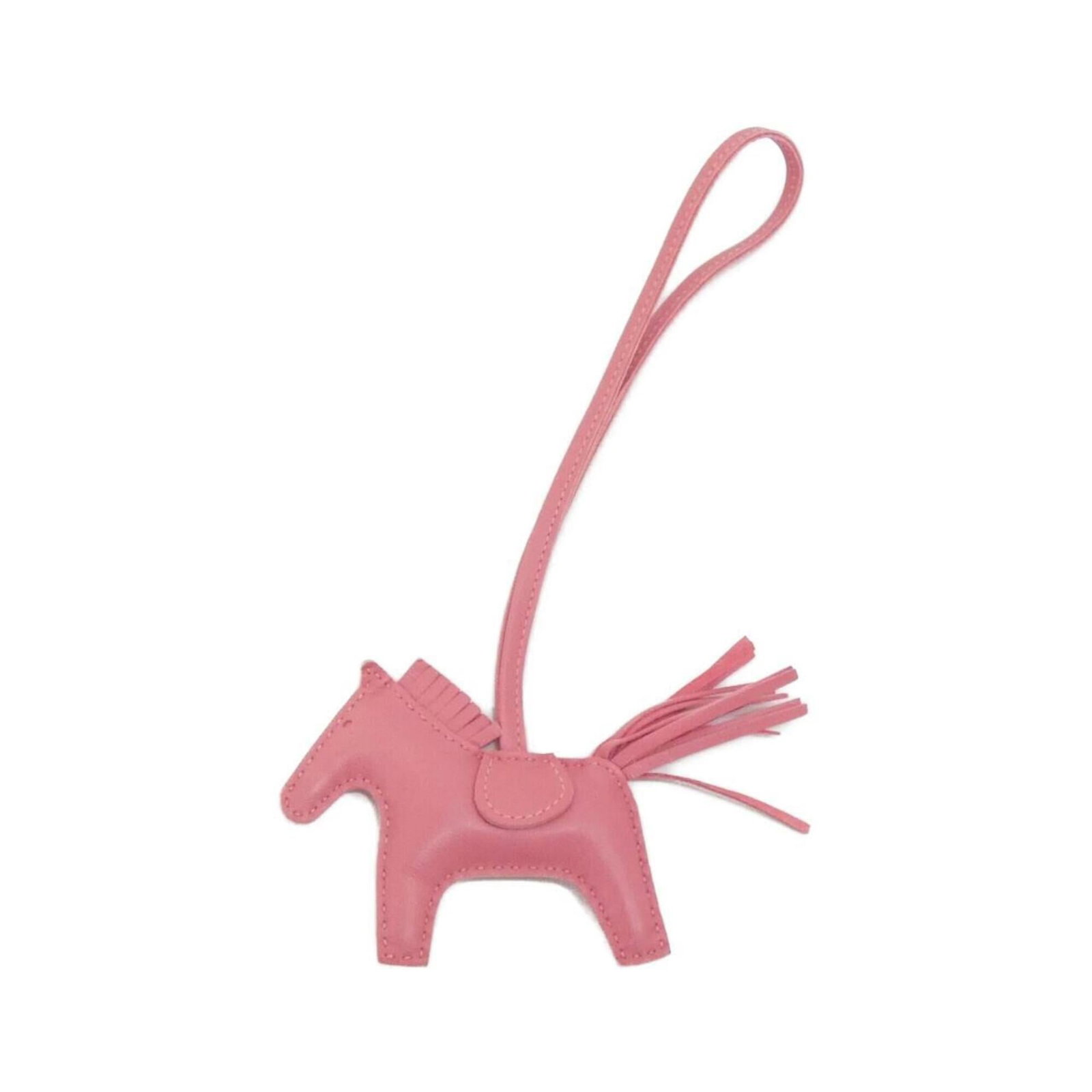 Hermes Handbag Charm Agneau Milo: Hermes Handbag Charm Agneau Milo Agneau Milo, the iconic Herm?s handbag charm, adds a touch of elegance to any accessory. This pink Agneau Milo charm features a delicate design and measures 7.50mm x 8
