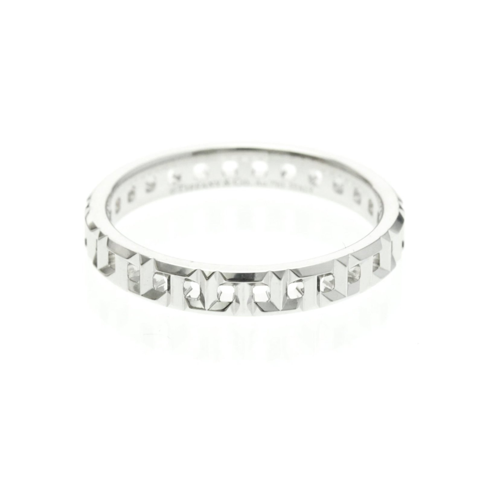 Tiffany Band Ring White Gold (18K): Tiffany Band Ring White Gold (18K) Tiffany Band Ring White Gold (18K) is a stylish and elegant fashion ring featuring 18K white gold metal with a slim width of 3.5mm. This used band ring has some mino