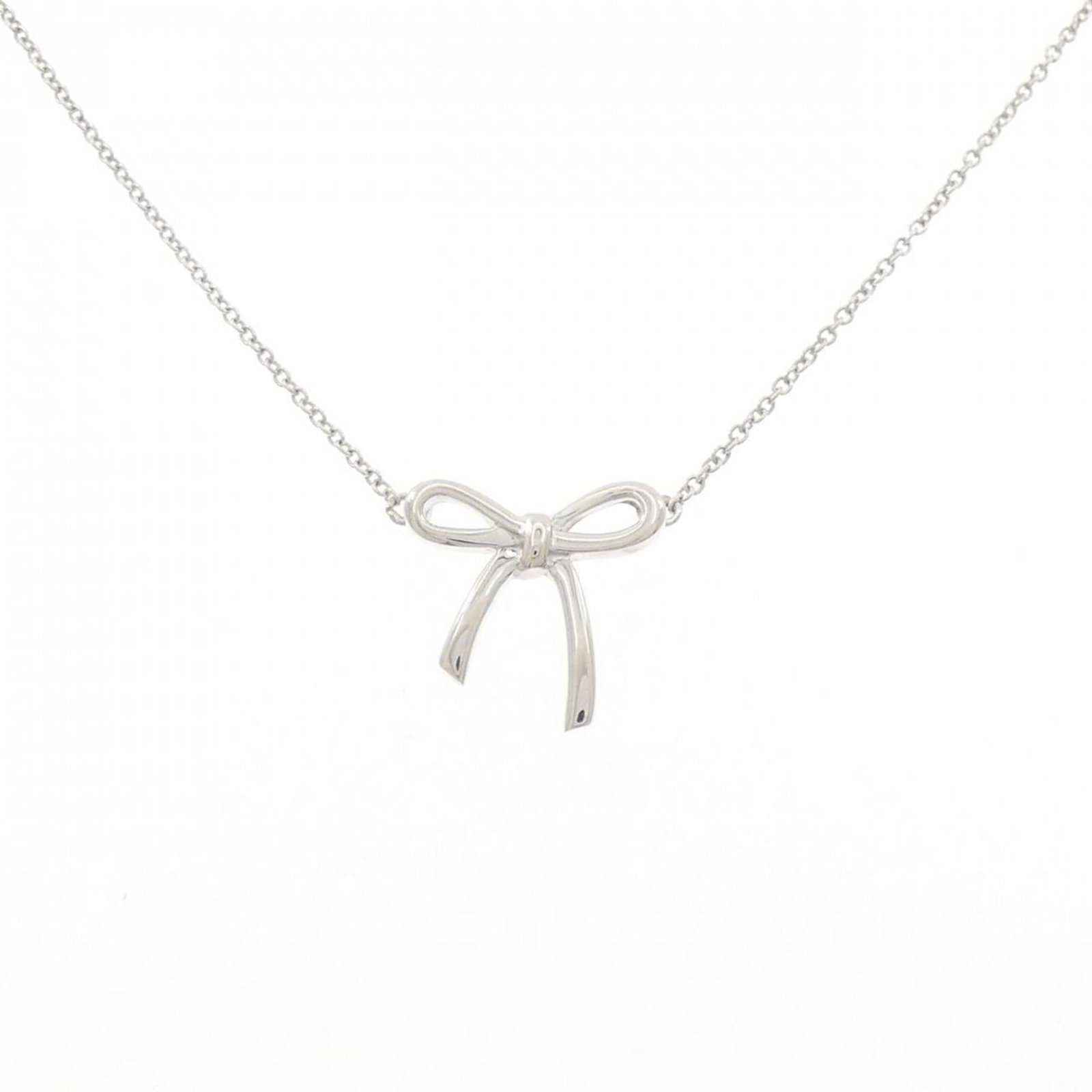 Bow Necklace Tiffany: Bow Necklace Tiffany Silver 925 Tiffany Necklace with Bow Pendant, featuring a 14.2mm x 14.7mm pendant on a 40 cm chain, in very good condition with some minor scratches and dirt, bearing a