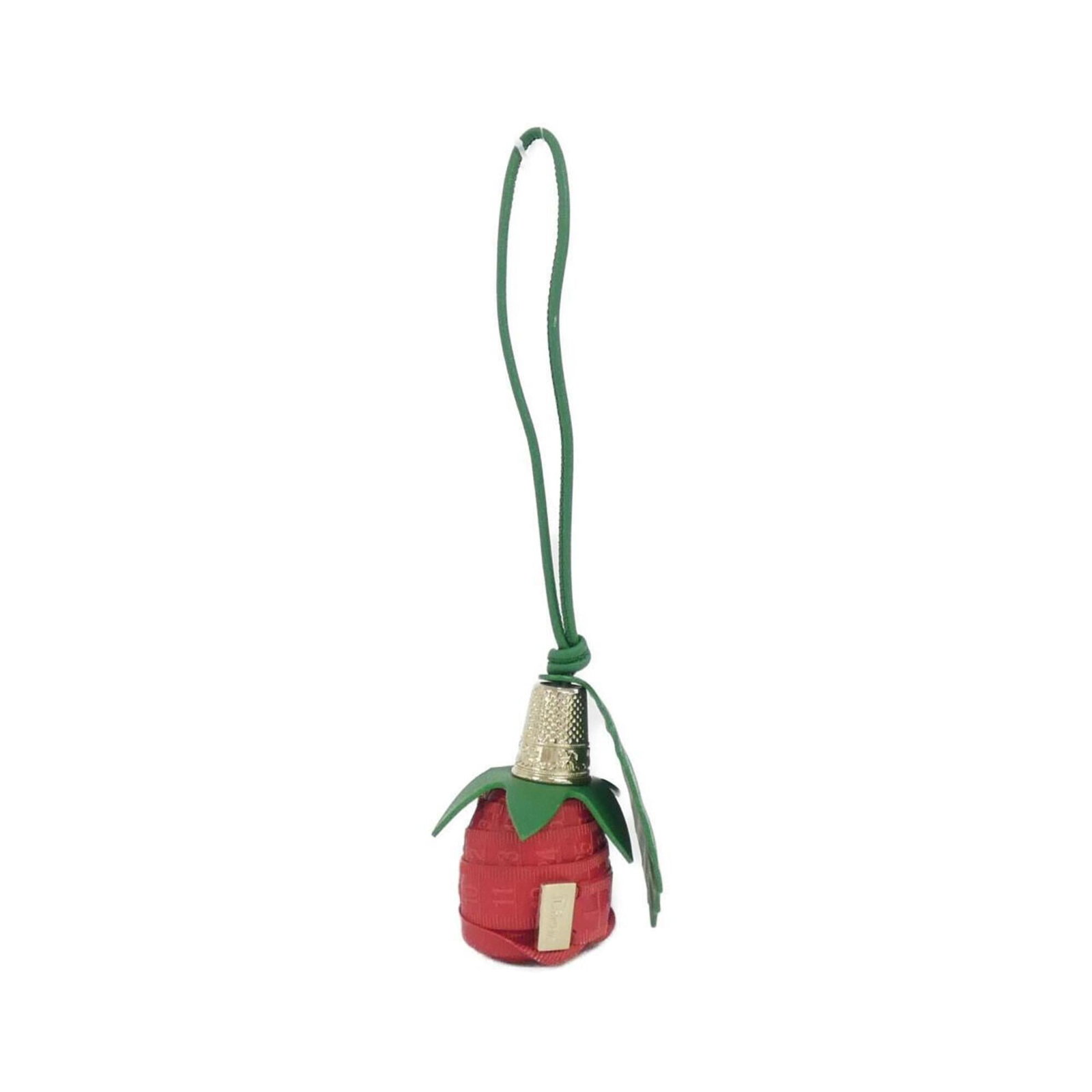 Christian Dior Handbag Charm Leather: Christian Dior Handbag Charm Leather This Christian Dior handbag charm features high-quality calfskin leather in two striking colors, green and red. The item shows signs of gentle use, with a few
