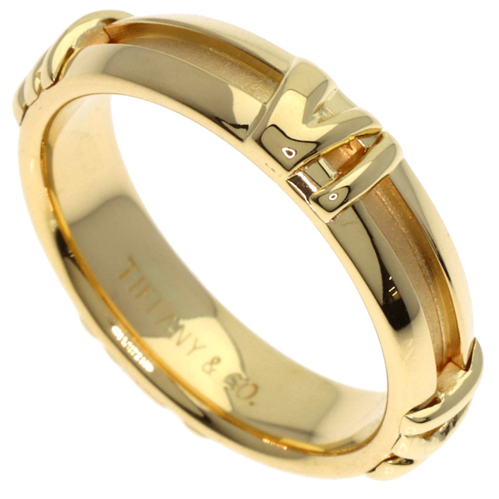 Tiffany Band Ring: Tiffany Band Ring 18K yellow gold band ring from Tiffany, featuring a slender 4.4mm width and weighing 4.7g. This used ring shows some traces of usage with minor scratches and dirt, but remains in