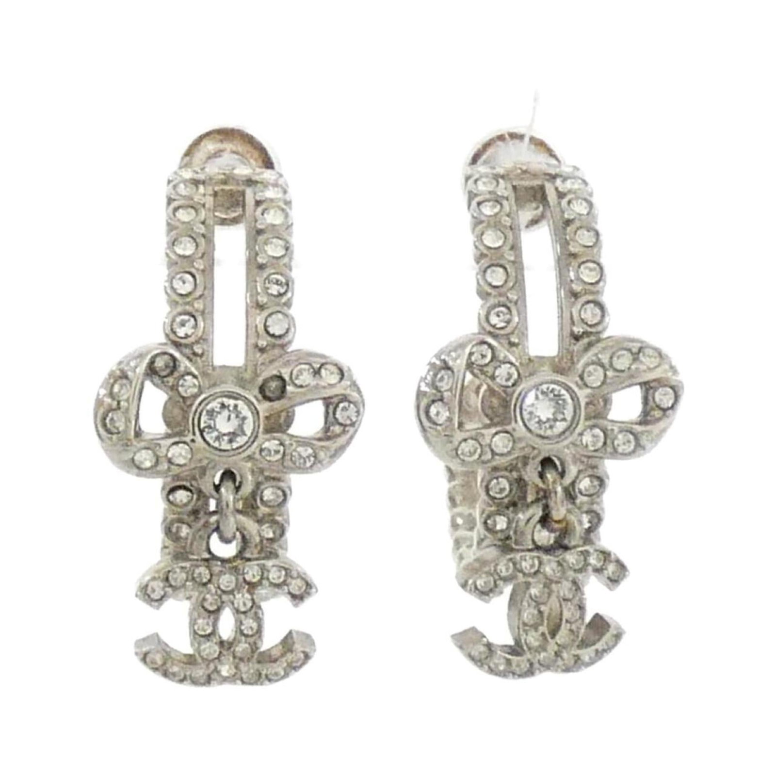 Hoop Earrings by Chanel: Hoop Earrings by Chanel Hoop earrings by Chanel in silver with crystal stones, measuring 20.00mm x 13.00mm. The earrings have a few traces of usage and some scratches/dirt, but remain in very good con