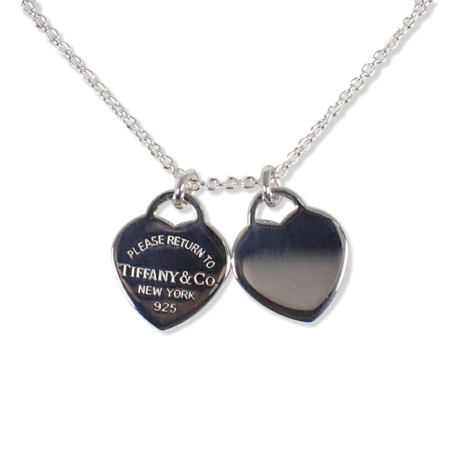 Tiffany & Co. 925 Return To Tiffany Double Heart Tag Pendant: Tiffany & Co. 925 Return To Tiffany Double Heart Tag Pendant Sterling silver pendant with intricate double heart design, crafted by Tiffany & Co. The Return To Tiffany collection features classic