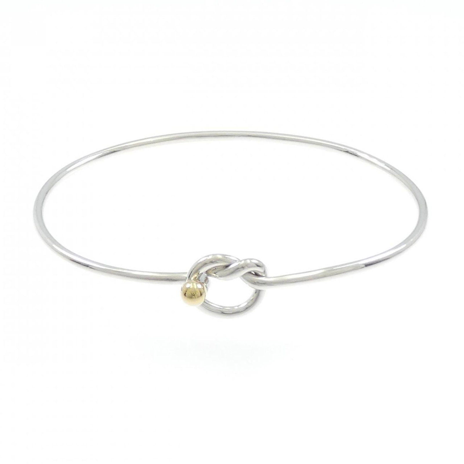 Tiffany Charm Bracelet Silver 925 Yellow Gold (18K): Tiffany Charm Bracelet Silver 925 Yellow Gold (18K) Silver 925 Yellow Gold (18K) charm bracelet from Tiffany, featuring a classic design with a few traces of usage visible. The bracelet has some scrat