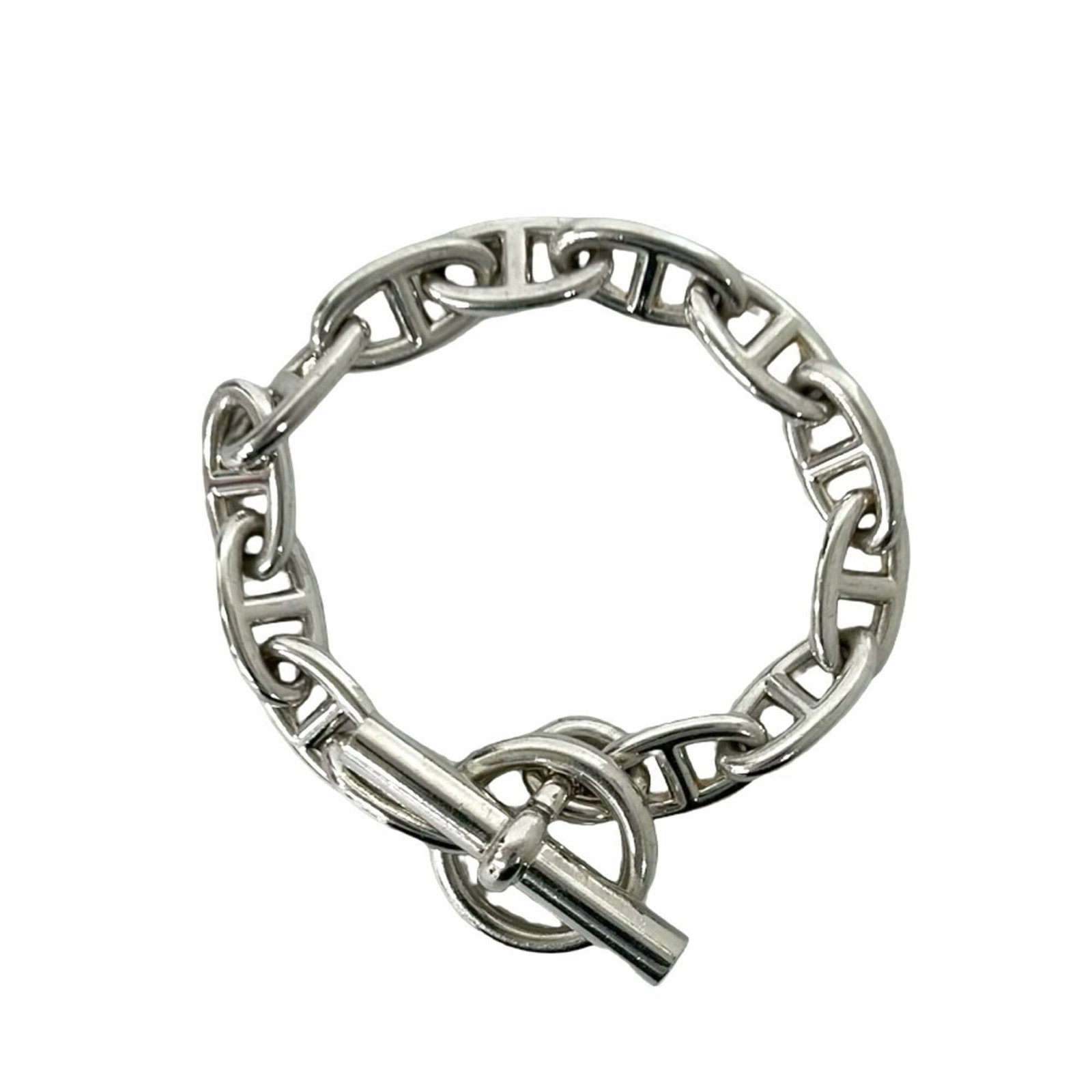 Silver Charm Bracelet 925 by Hermes: Silver Charm Bracelet 925 by Hermes Silver Charm Bracelet 925 by Hermes. This pre-owned charm bracelet features sterling silver construction and bears the iconic brand mark, showcasing its connection 
