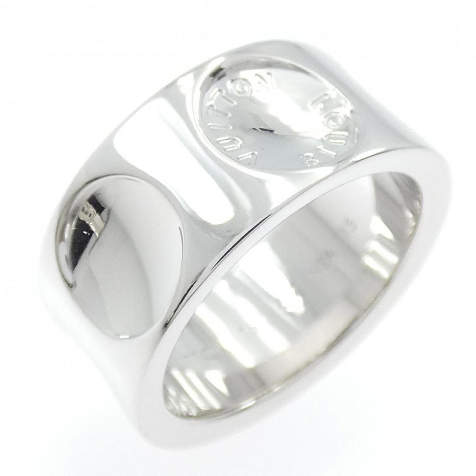 Louis Vuitton Band Ring White Gold (18K): Louis Vuitton Band Ring White Gold (18K) This Louis Vuitton band ring in white gold (18K) boasts a sleek, modern design. With its signature LV monogram pattern and durable 18K white gold construction,