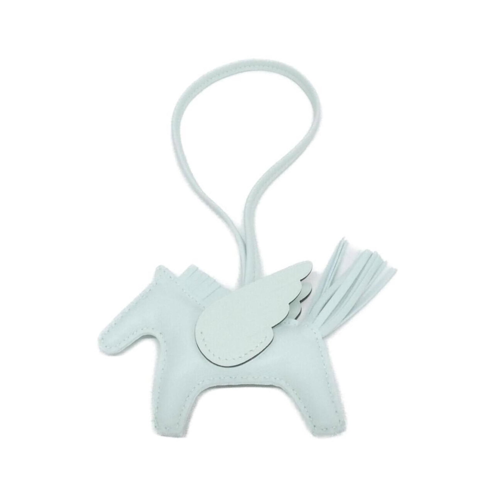 Hermes Handbag Charm Agneau Milo: Hermes Handbag Charm Agneau Milo Agneau Milo, the iconic Herm?s handbag charm, adds a touch of elegance to any accessory. This light green, Vert-colored Agneau Milo features a subtle sheen and measure
