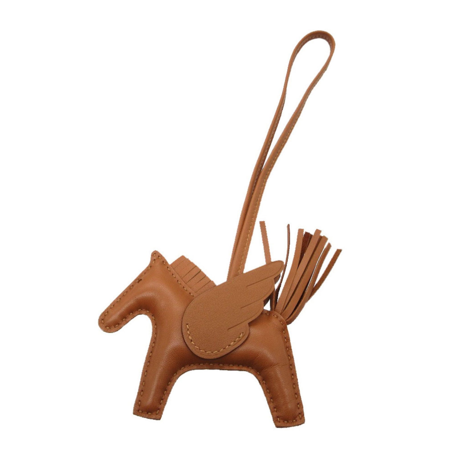 Handbag Charm Agneau Milo: Handbag Charm Agneau Milo Agneau Milo charm from Hermes, a brown handbag accessory with some traces of usage and minor scratches. The charm measures 75mm x 90mm and is in very good condition despite s