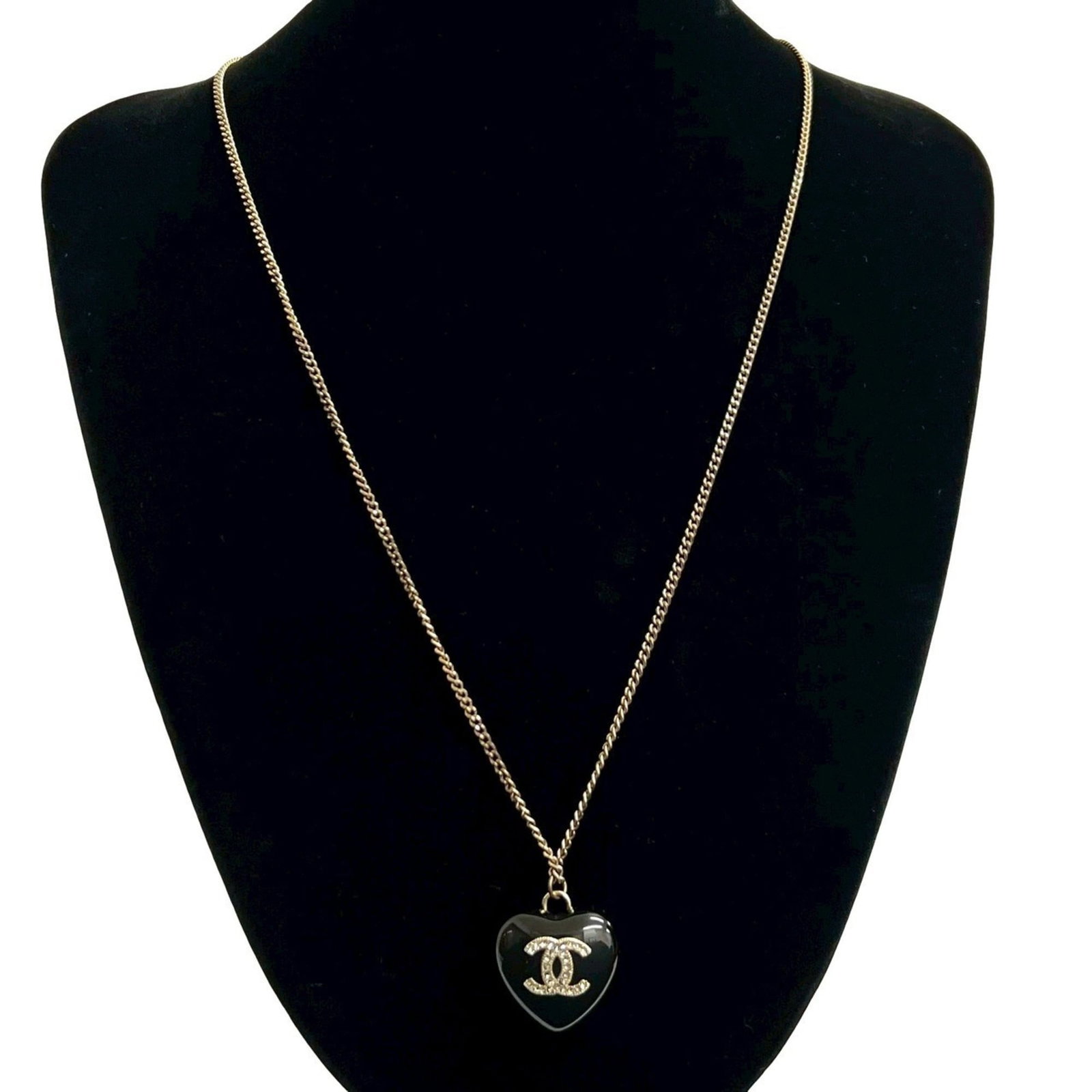 Coco Mark Black Necklace GP Rhinestone Plastic Heart Motif Chanel: Coco Mark Black Necklace GP Rhinestone Plastic Heart Motif Chanel Gold Plating, Plastic, and Rhinestone details come together in this Coco Mark Black Necklace featuring a GP Rhinestone Plastic Heart M
