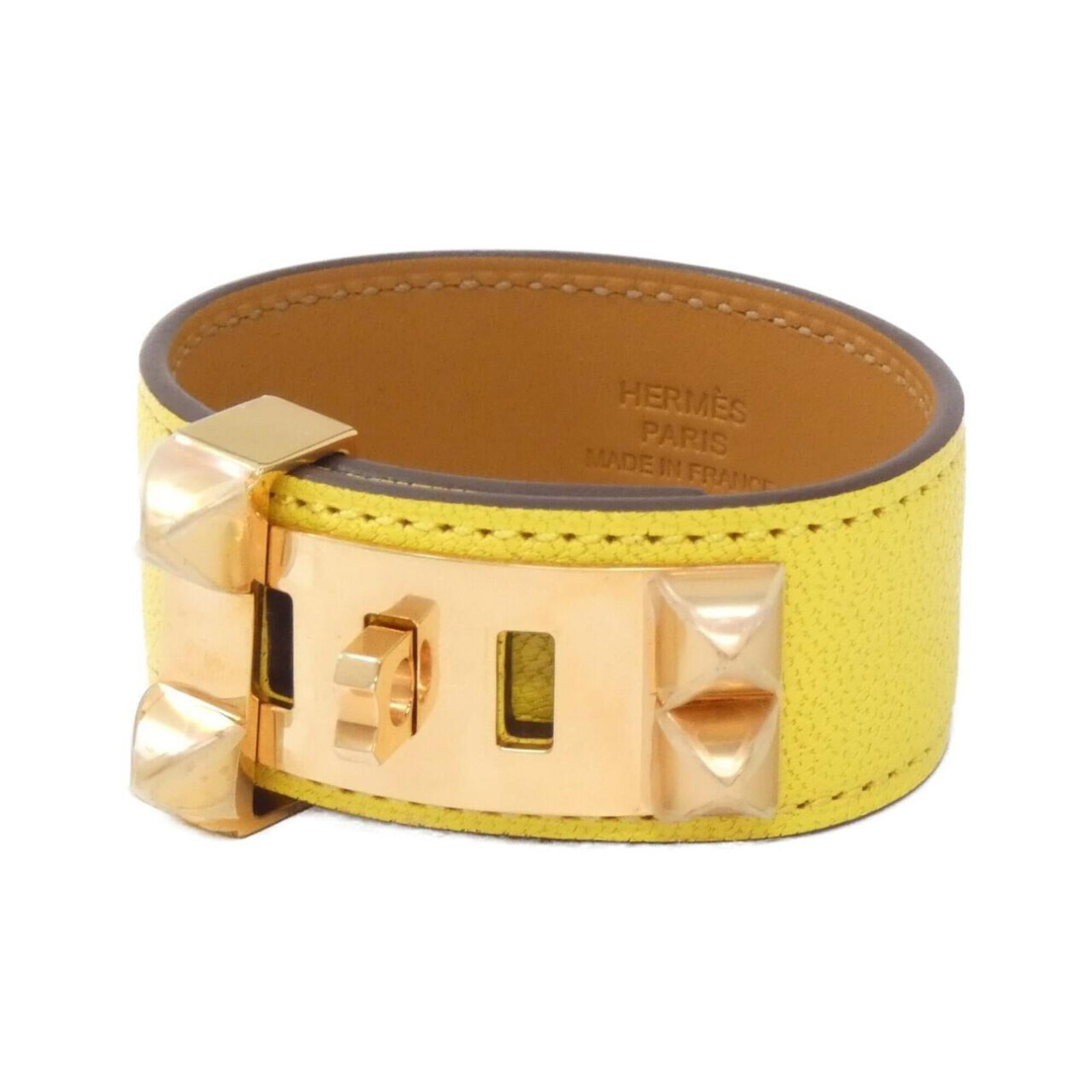 Hermes Charm Palladium Leather Bracelet: Hermes Charm Palladium Leather Bracelet Palladium leather wraps around your wrist in elegant charm, adorned with the iconic Hermes style. This used bracelet boasts a timeless design, bearing a few sub