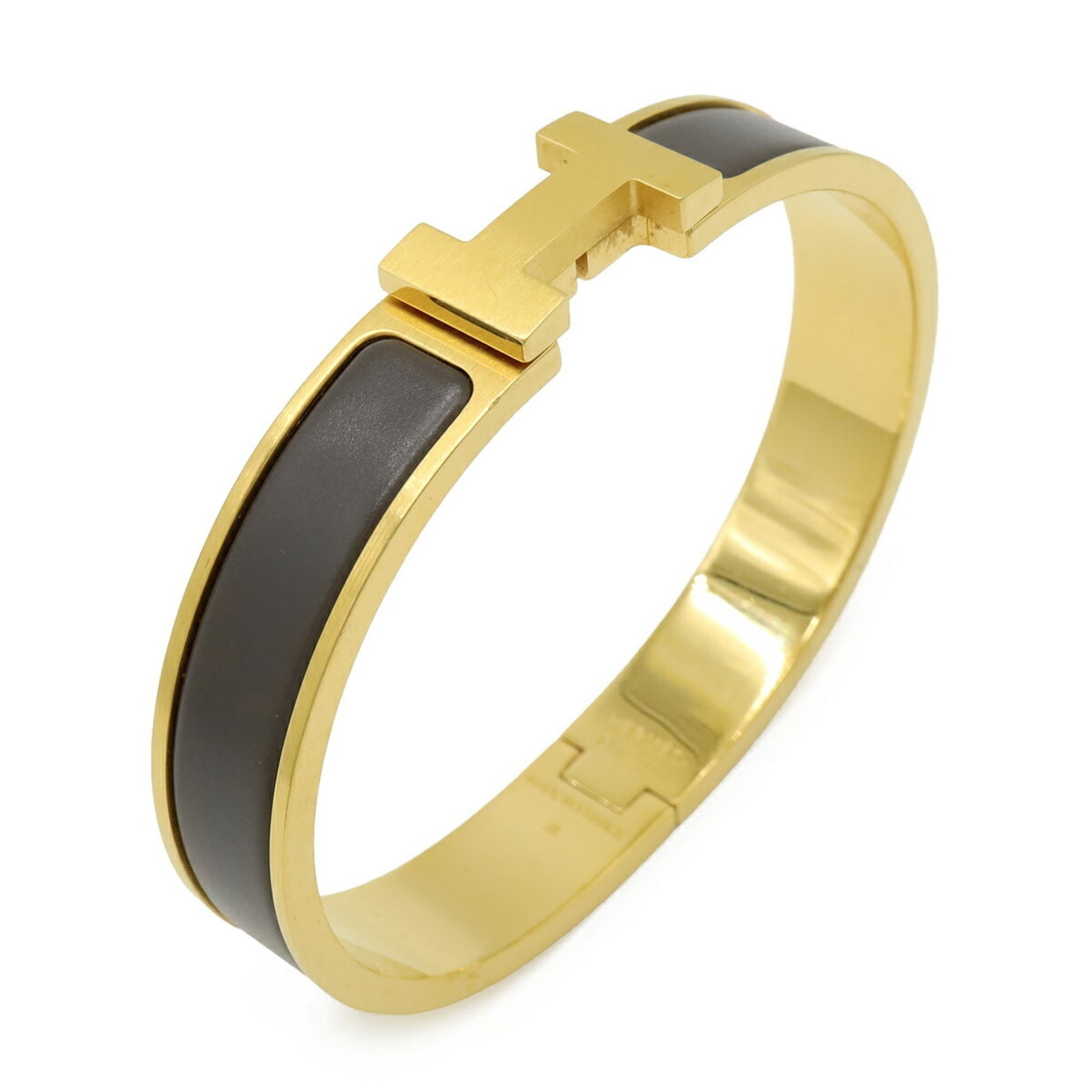 Charm Bracelet by Hermes: Charm Bracelet by Hermes Gold plated charm bracelet from Herm?s, with a length of 17.5cm and a width of 1.1cm, bearing traces of usage and minor scratches. This used charm bracelet is in good conditio