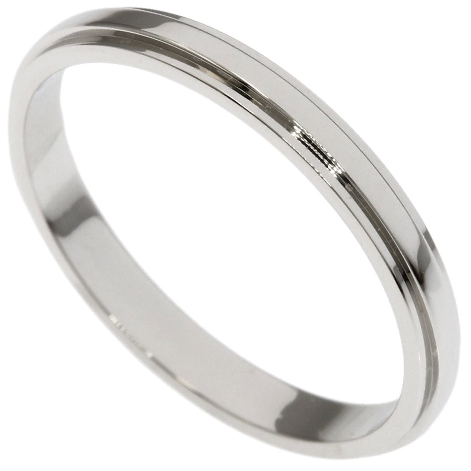 Ring Band by Platinum 950: Ring Band by Platinum 950 Platinum 950 band ring by Cartier, featuring a sleek and sophisticated design. The ring bears a few traces of usage, with some scratches and dirt visible, but remains in very