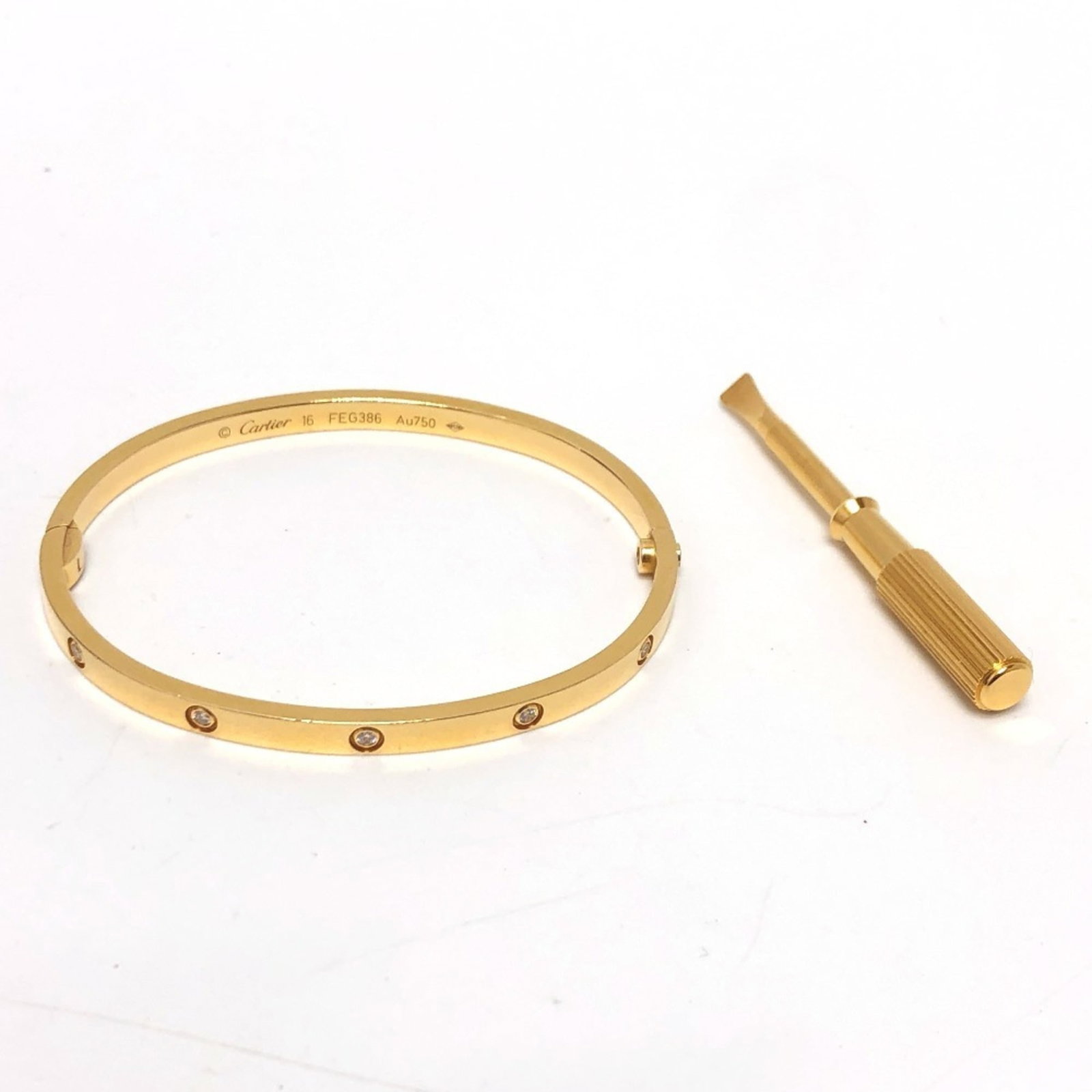 Cartier Bangle Yellow Gold (18K): Cartier Bangle Yellow Gold (18K) Cartier Bangle Yellow Gold (18K) features a timeless design in 18-karat yellow gold, measuring 15cm in length. The bangle bears some traces of usage and minor