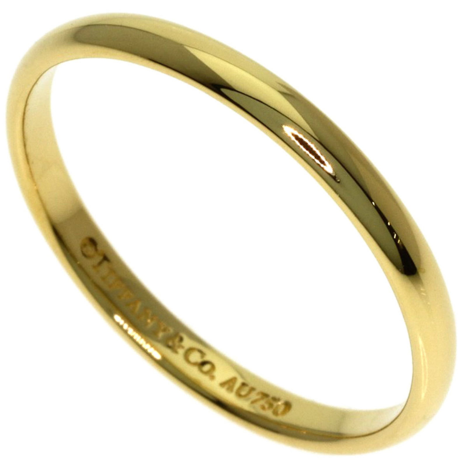 Tiffany Ring Gold Yellow 18K: Tiffany Ring Gold Yellow 18K Yellow Gold 18K Tiffany Ring Band for Women. This used band ring features yellow gold (18K) material and bears a signature, showcasing its unique characteristics. With som