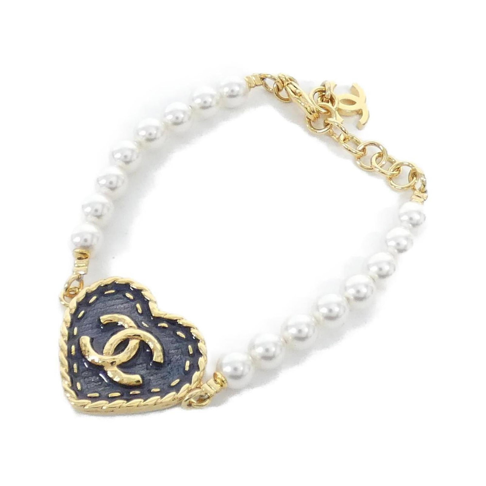 Charm of Chanel: Charm of Chanel Charm of Chanel boasts a striking blue and white design, adding a touch of elegance to any outfit. Measuring 16.5cm - 19cm in length, this versatile charm bracelet offers a subtle yet 