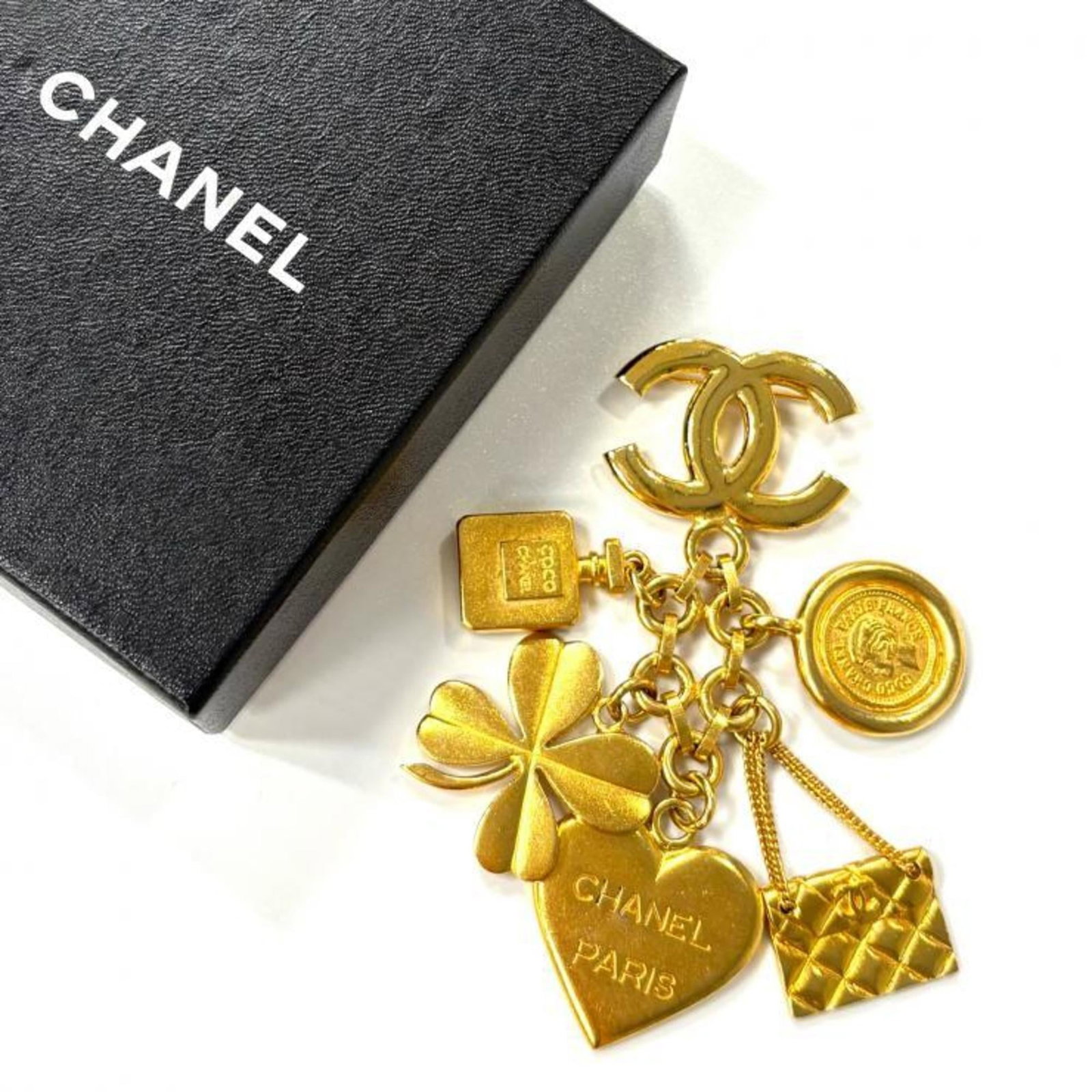 Gold Plating Brooch Chanel: Gold Plating Brooch Chanel Gold Plating Brooch Chanel bears a signature, and its gold plating gives it a luxurious touch. This vintage brooch has traces of usage, with scratches and dirt visible, but 