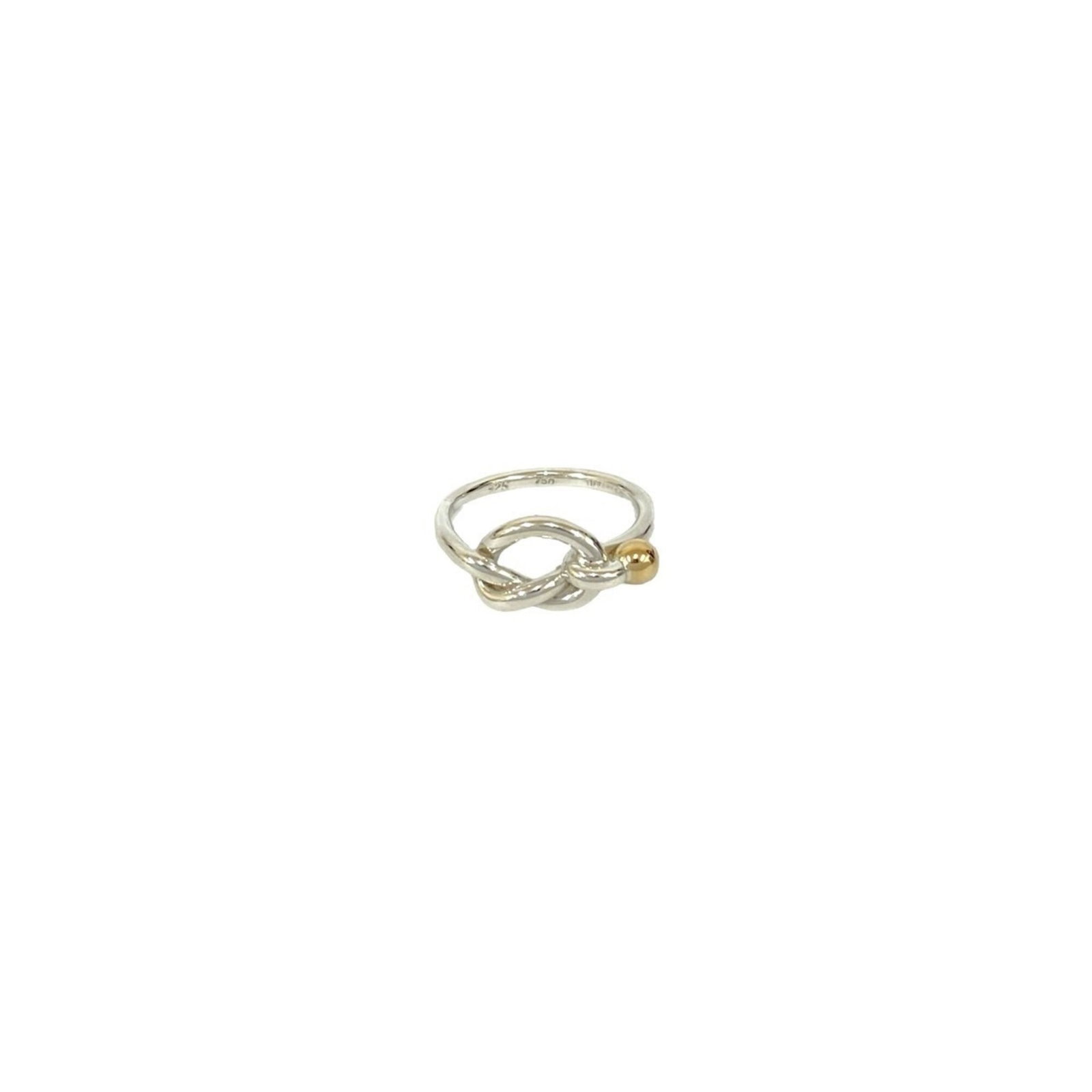 Tiffany Band Ring Silver 925 Yellow Gold (18K): Tiffany Band Ring Silver 925 Yellow Gold (18K) Silver 925 band ring with a touch of yellow gold (18K) adds a subtle shine to the wearer's style. This pre-owned piece bears the Tiffany brand and has