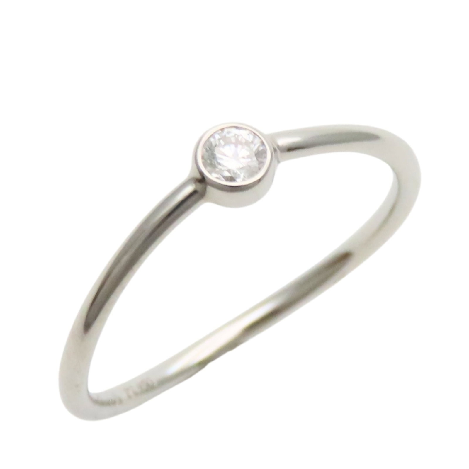 Platinum ring by Tiffany band: Platinum ring by Tiffany band Platinum ring by Tiffany & Co. features a sleek band design in platinum, available in US size 4.5. This piece has been meticulously maintained and presents like new,