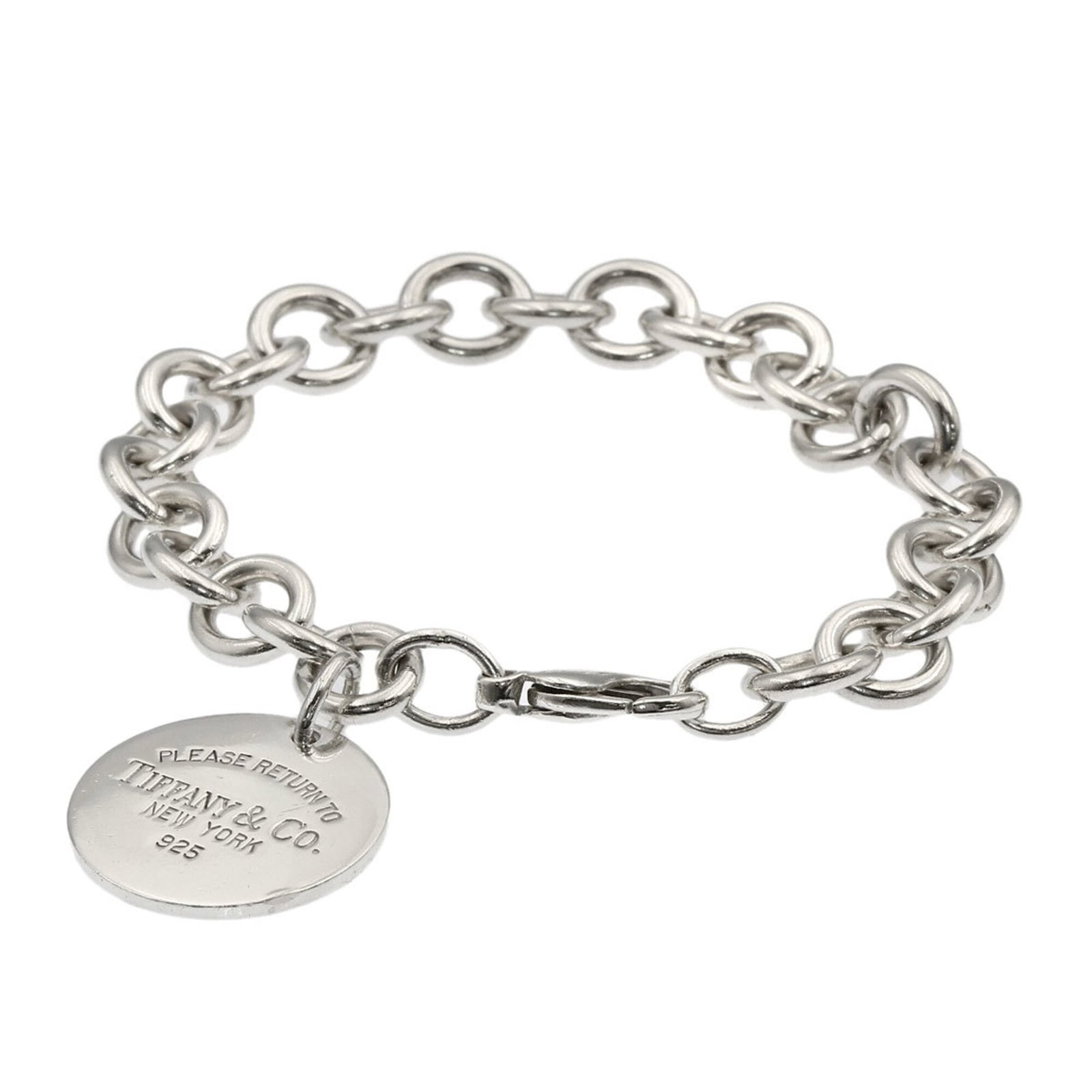 Charm bracelet silver of Tiffany: Charm bracelet silver of Tiffany Silver Tiffany charm bracelet with a length of 17cm, featuring subtle traces of usage and minor scratches. This used charm bracelet is in very good condition, showcasi