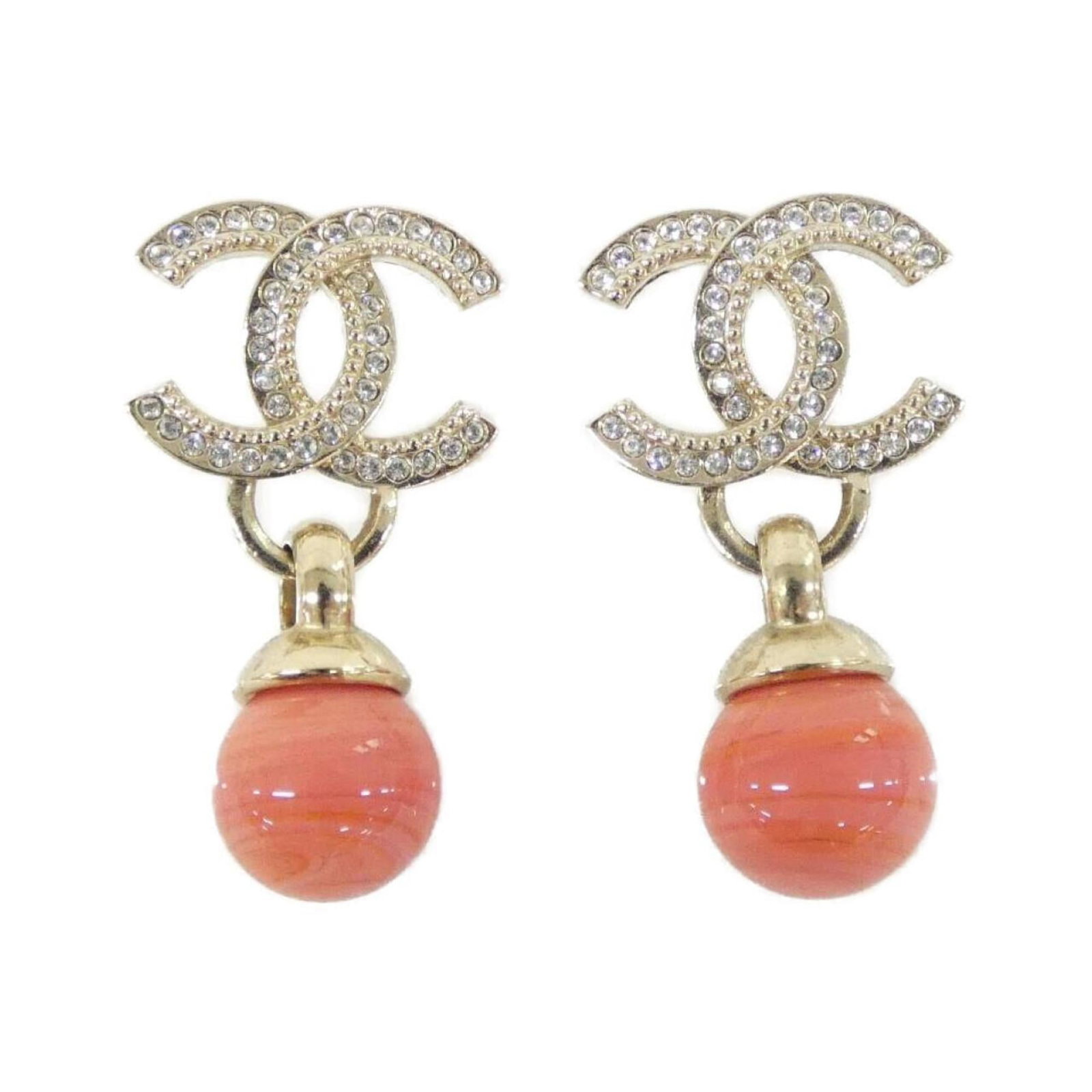 Chanel Stud Earrings: Chanel Stud Earrings Gold stud earrings from the iconic Chanel brand, featuring a classic design with subtle details. The earrings have some minor scratches and dirt, but remain in very good condition