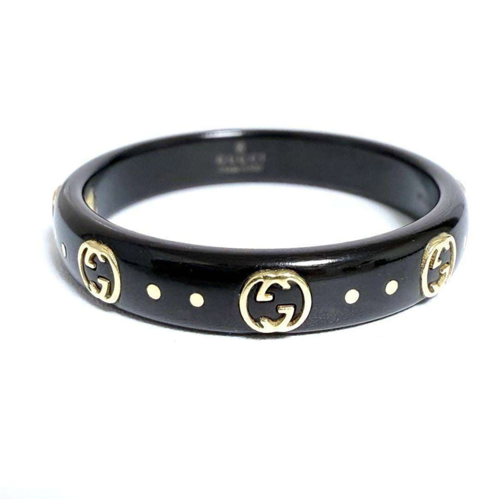 Gucci Band Ring Yellow Gold (18K): Gucci Band Ring Yellow Gold (18K) This Gucci Band Ring in yellow gold (18K) showcases the luxury brand's signature style. With its subtle scratches and signs of wear, this used ring still exudes a sle
