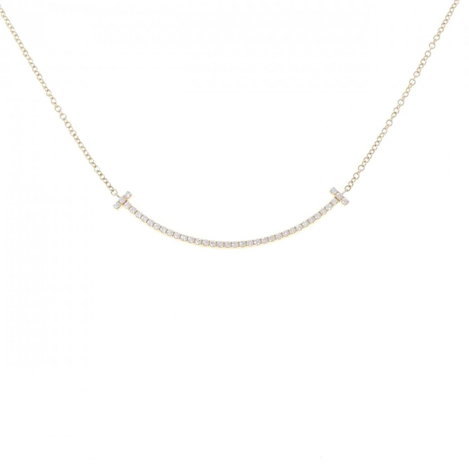 Smile of Tiffany T Necklace Small: Smile of Tiffany T Necklace Small Small Tiffany & Co. necklace pendant in yellow gold, featuring a 3.5mm x 36.9mm diamond set against a 41 cm chain, showcasing a classic design with subtle elegance. T