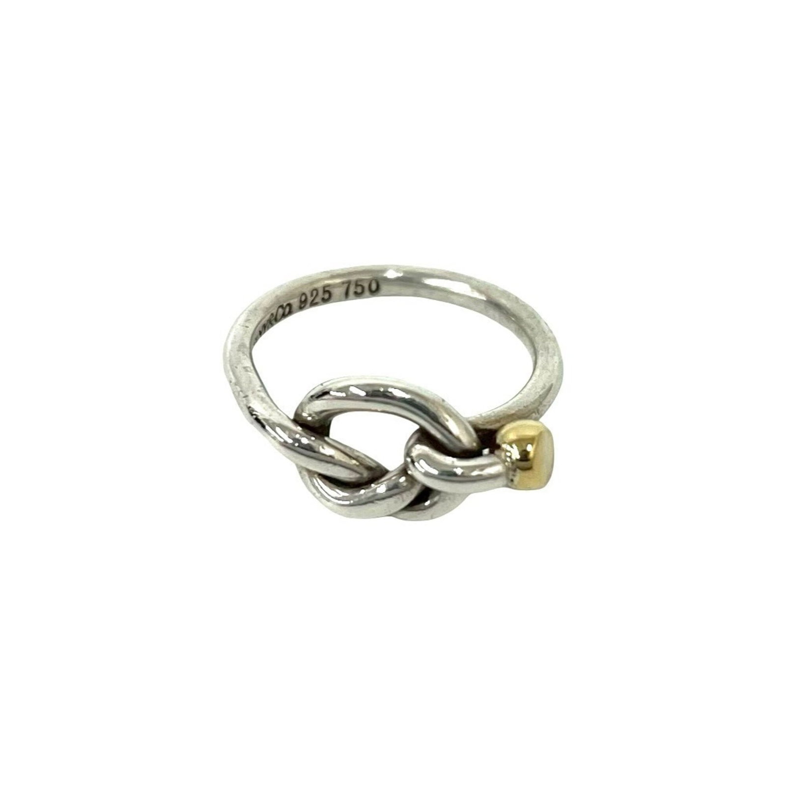 Tiffany Band Ring Silver 925 Yellow Gold (18K): Tiffany Band Ring Silver 925 Yellow Gold (18K) Silver 925 band ring with a touch of luxury, featuring 18K yellow gold accents. This pre-owned Tiffany piece boasts a classic design that still shines br
