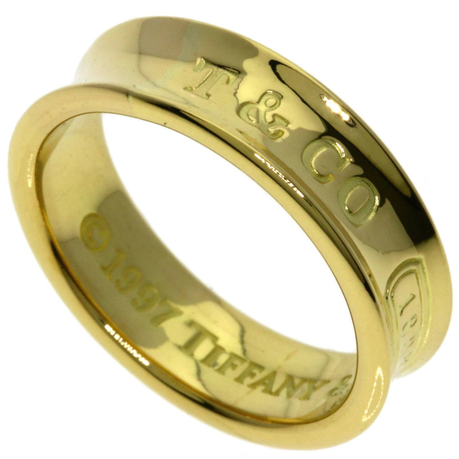 Tiffany Ring Gold Yellow 18K: Tiffany Ring Gold Yellow 18K Tiffany Ring Gold Yellow 18K - A Timeless Yellow Gold Band with a Rich History. This beautiful 18K yellow gold band features a delicate design and bears a signature,