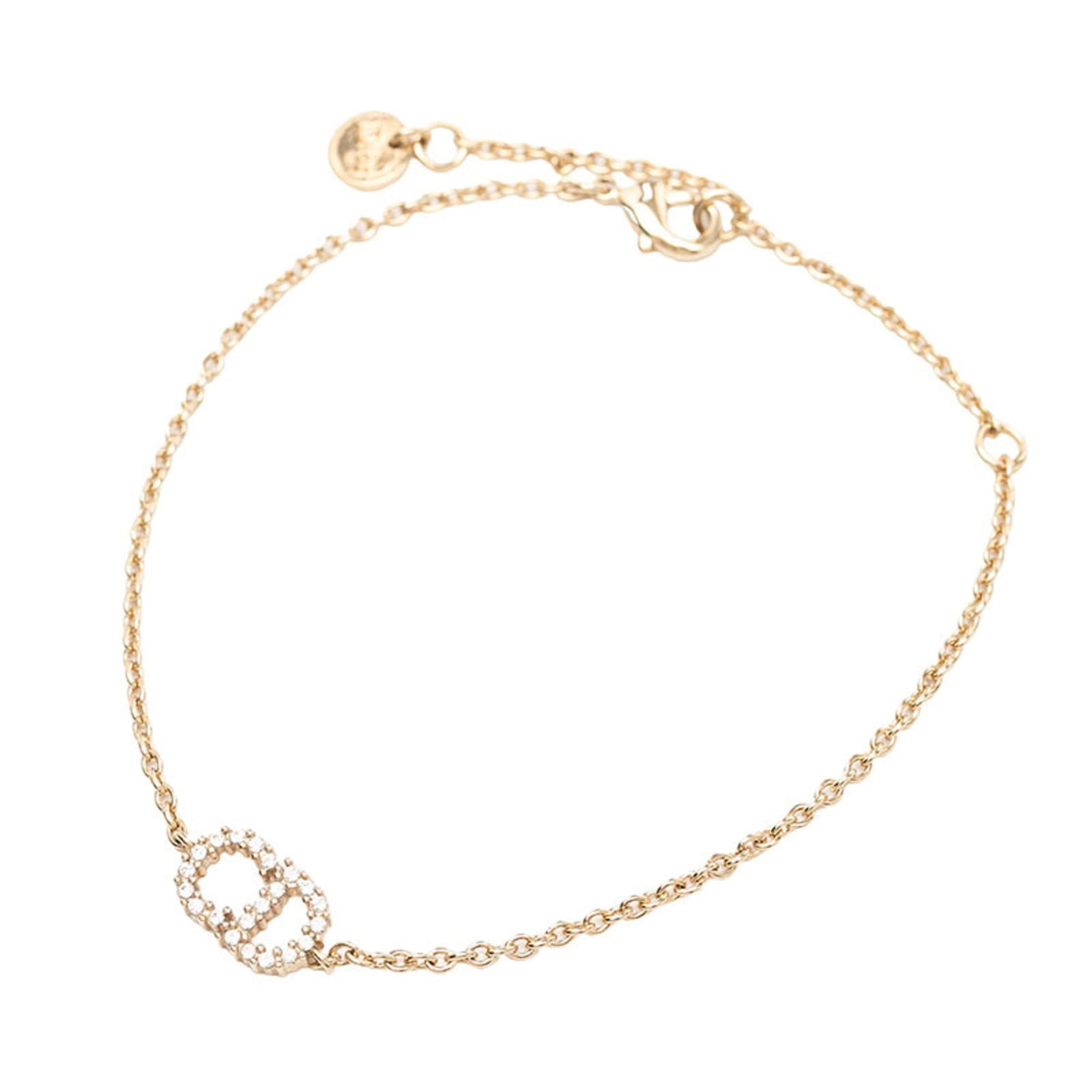 Christian Dior bracelet gold plating: Christian Dior bracelet gold plating Gold plating from the renowned Christian Dior brand adorns this charm bracelet, featuring a subtle gold hue and rhinestone accents. The 20.5cm length provides a