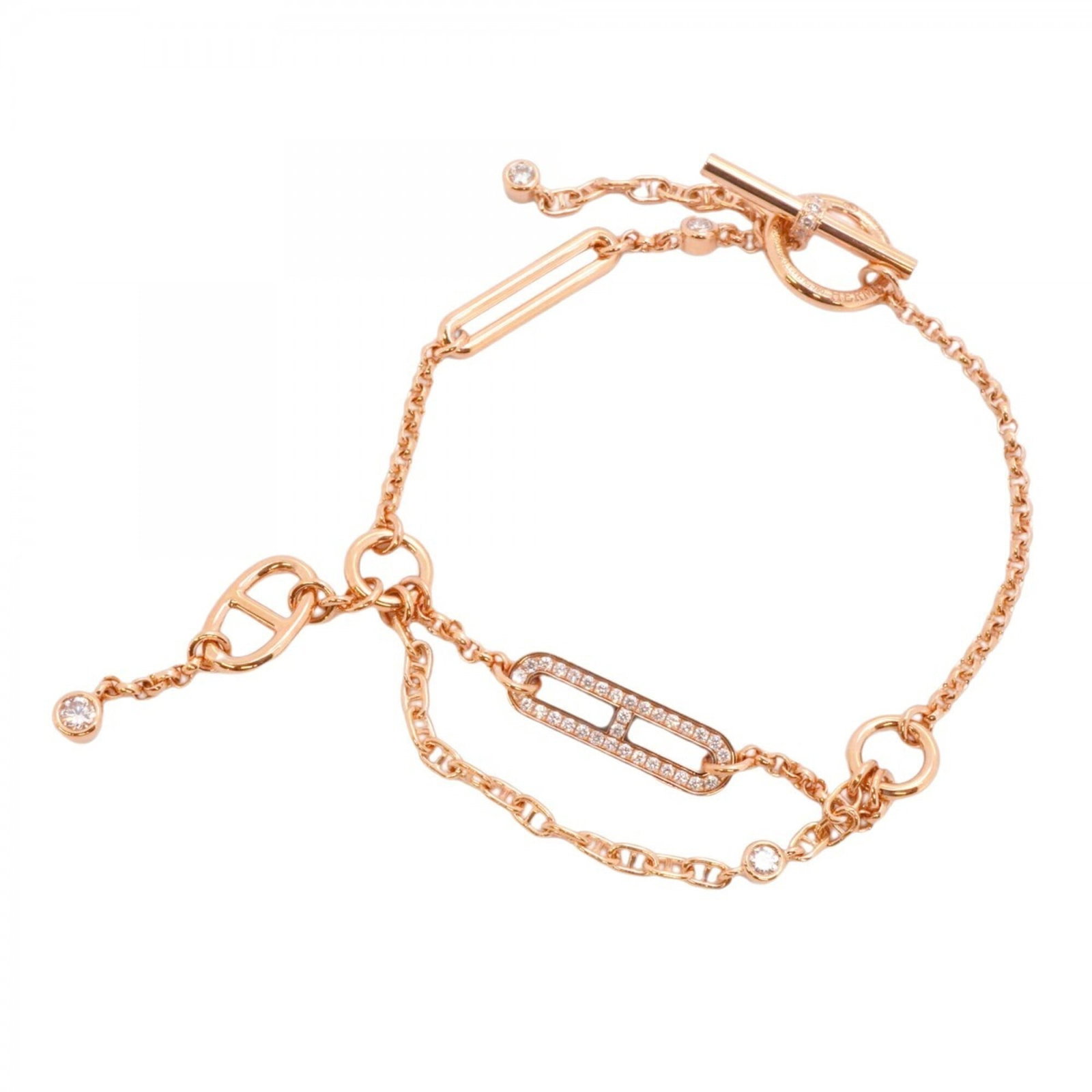 Pink Gold 18K Hermes Charm Bracelet: Pink Gold 18K Hermes Charm Bracelet Pink Gold 18K Hermes Charm Bracelet - A delicate and elegant accessory, this charm bracelet features 18k pink gold and adorned with a diamond stone. Measuring