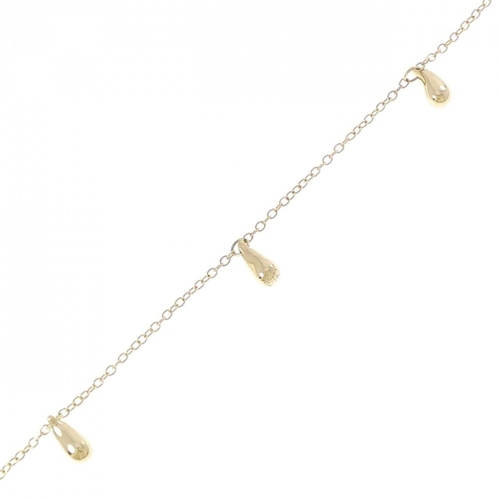 Tiffany Charm Bracelet Yellow Gold (18K): Tiffany Charm Bracelet Yellow Gold (18K) Yellow Gold (18K) Tiffany Charm Bracelet, featuring a classic design with subtle scratches and minor dirt accumulation, still exudes elegance in its worn condi