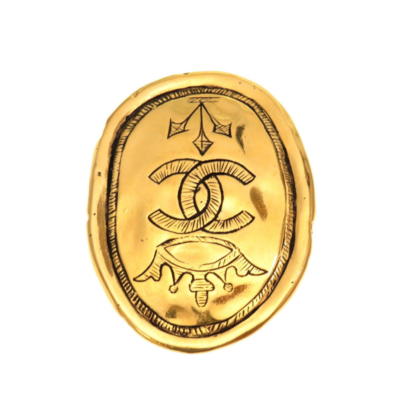 Metal brooch by Chanel: Metal brooch by Chanel Gold metal brooch by renowned fashion house Chanel, bearing subtle signs of past use. The intricate design showcases the brand's signature style, crafted from durable metal with
