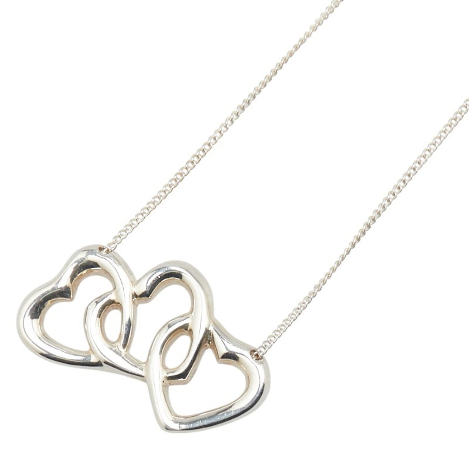 Triple Heart Necklace In Sterling Silver For Women By Tiffany: Triple Heart Necklace In Sterling Silver For Women By Tiffany Sterling silver necklace with intricate triple heart design, crafted by Tiffany. The necklace features a beautiful stone setting and measu