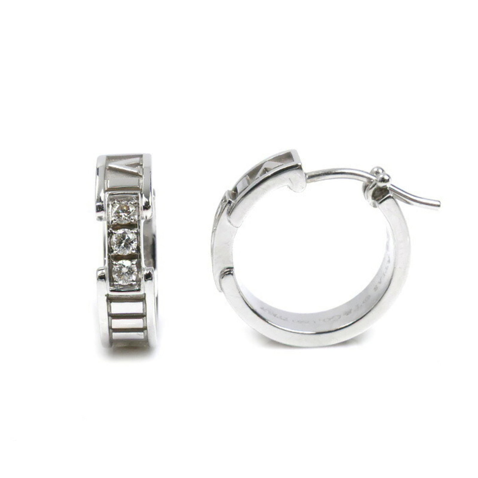 White Hoop Tiffany Earrings in 18K Gold: White Hoop Tiffany Earrings in 18K Gold White Hoop Tiffany Earrings in 18K Gold are crafted from high-quality white gold, featuring a classic hoop design. The earrings have been used and show signs