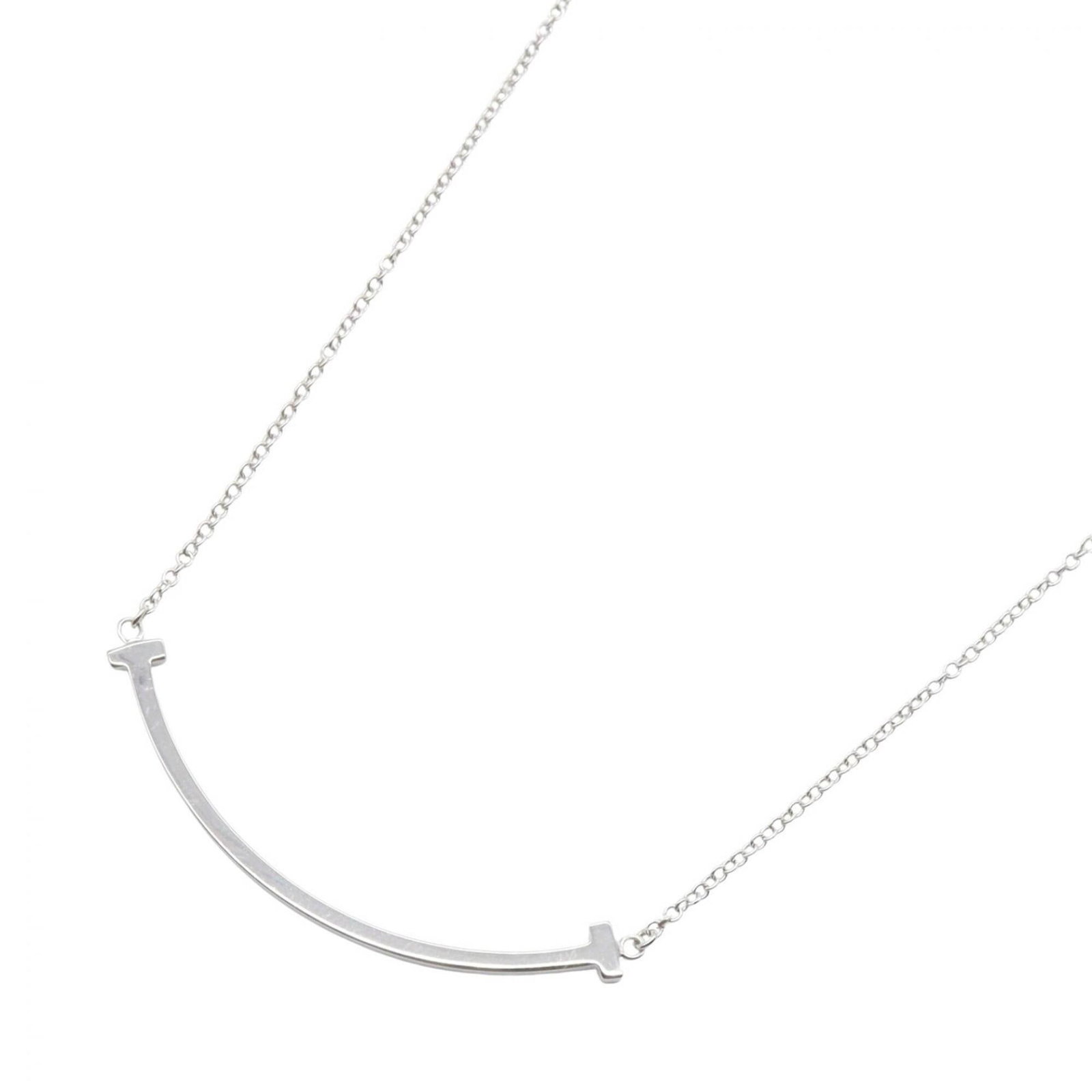 Tiffany & Co. T Smile Small Necklace 750Wg (Silver Tone) Women'S Jewelry: Tiffany & Co. T Smile Small Necklace 750Wg (Silver Tone) Women'S Jewelry Tiffany & Co. T Smile Small Necklace in Silver Tone features a delicate 3mm x 37mm white gold (18K) pendant suspended from a ch