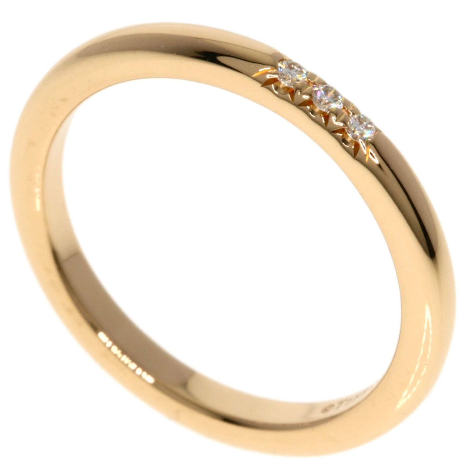 Pink Gold Ring Band Tiffany: Pink Gold Ring Band Tiffany Pink Gold Ring Band Tiffany features a delicate 18K pink gold band adorned with a diamond, showcasing the elegant simplicity of Tiffany's design. The ring bears a signature