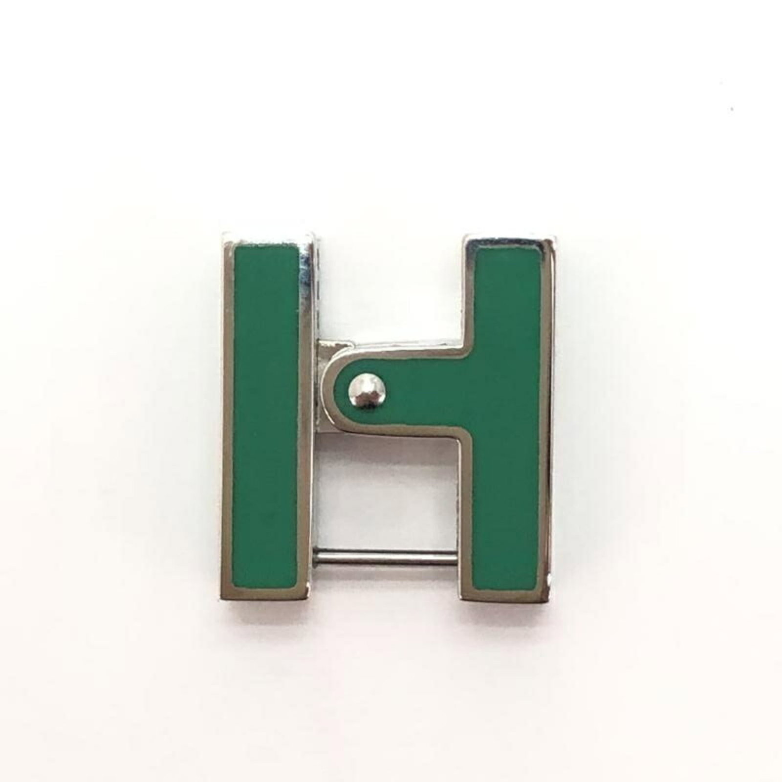 Hermes Stud Earrings: Hermes Stud Earrings Stunning green stud earrings from the iconic French fashion house Hermes, bearing subtle traces of previous use. Measuring 18mm x 16mm, these earrings showcase a unique blend of
