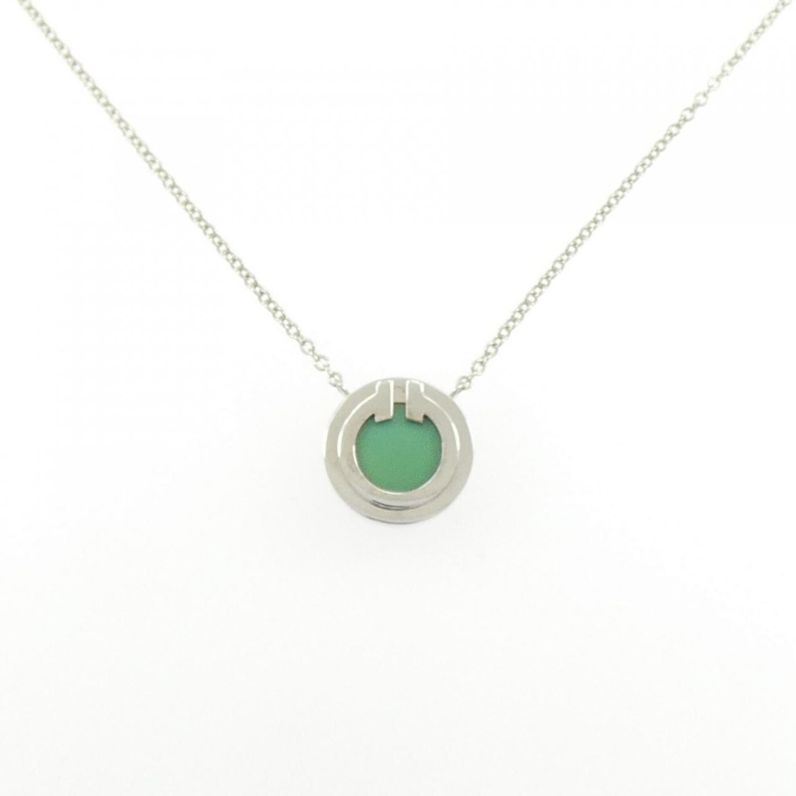 Tiffany T-Two Necklace: Tiffany T-Two Necklace Tiffany T-Two Necklace features a stunning turquoise stone set in white gold (18K) with a classic necklace design. The piece boasts a timeless look, with the turquoise pendant s