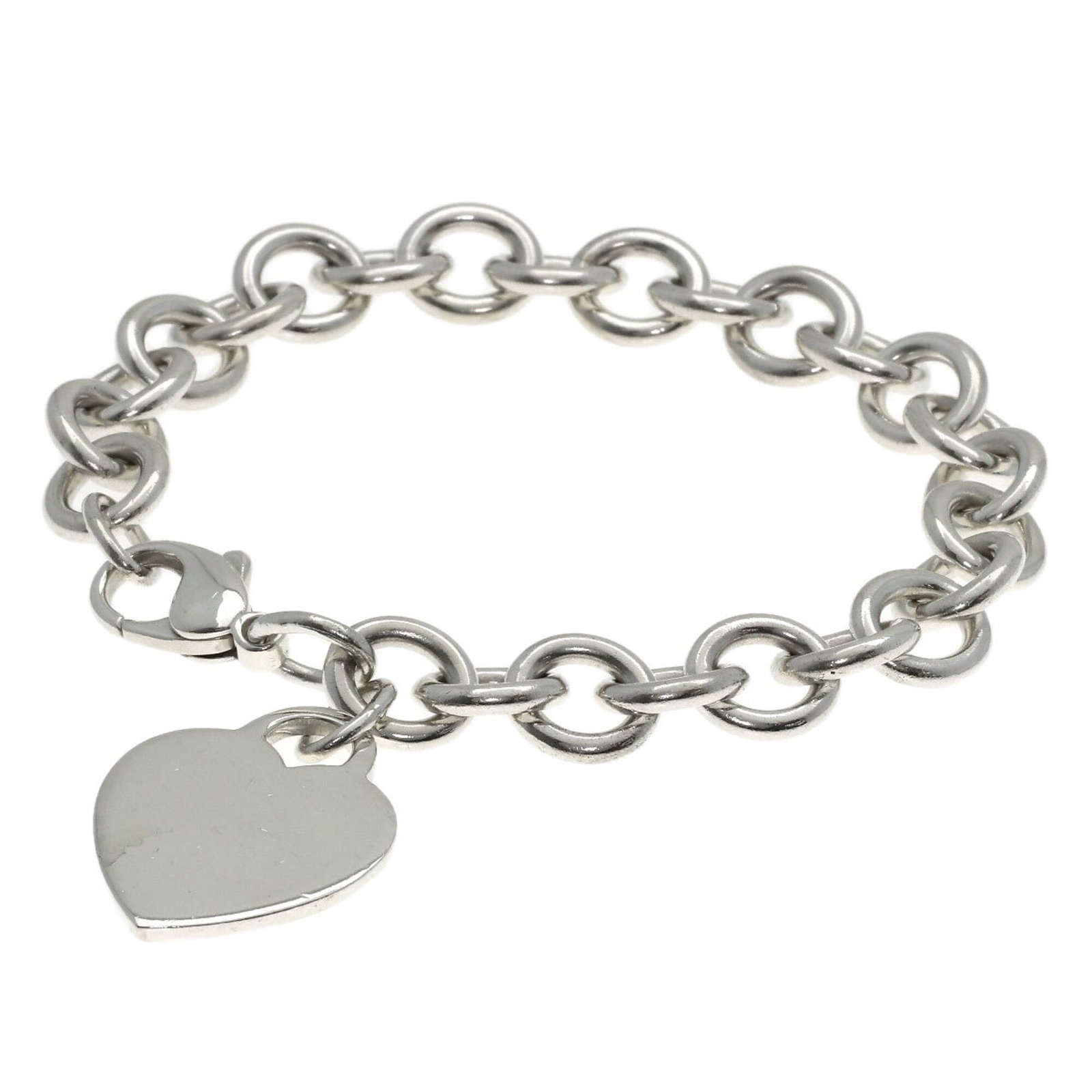 Charm bracelet silver of Tiffany: Charm bracelet silver of Tiffany Silver Tiffany charm bracelet, featuring a classic design with a few traces of usage visible. The bracelet measures 17.5cm in length and shows some minor scratches and